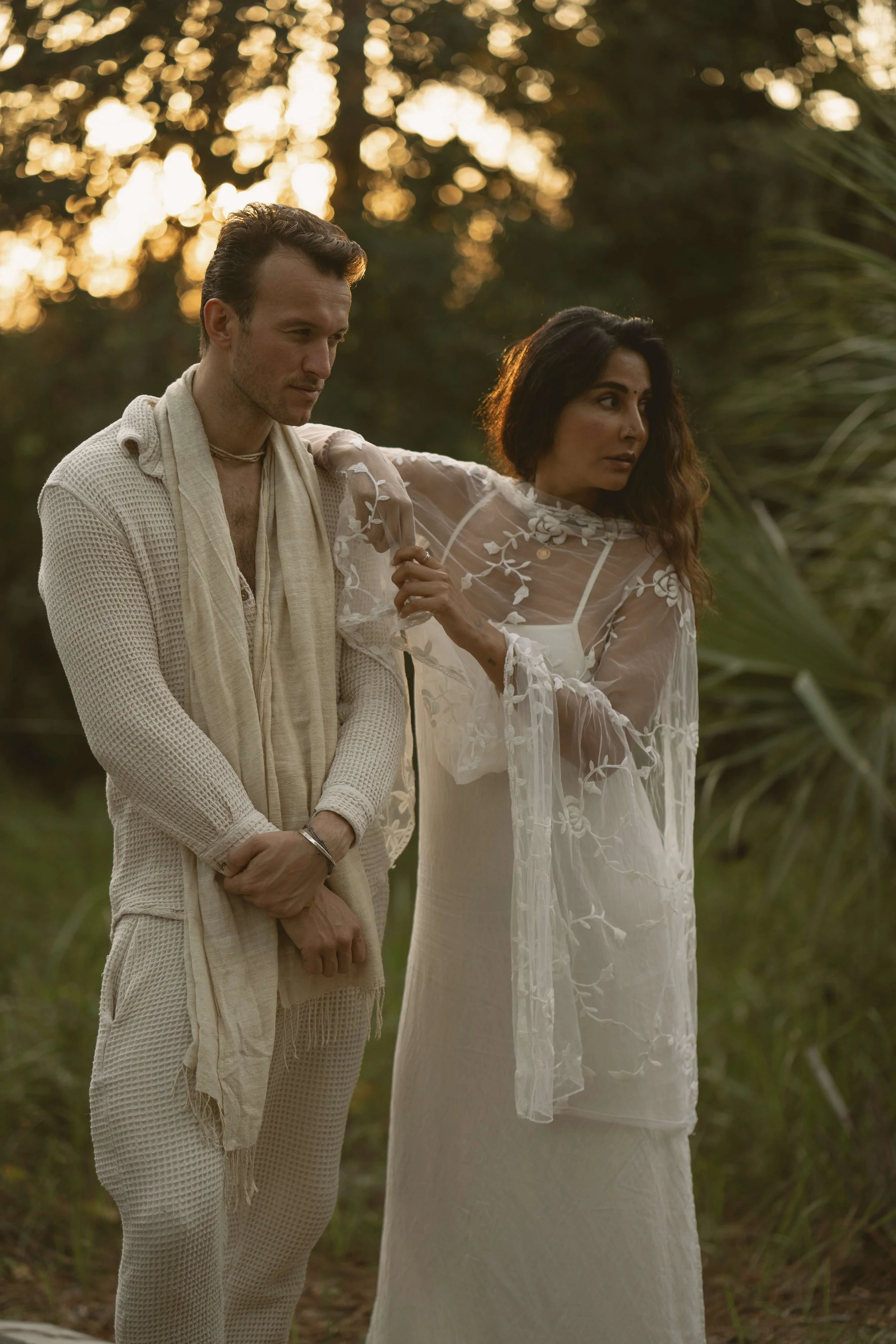 An intimate couple’s elopement at sunset. A minimalist wedding ceremony set against a quiet, expansive natural landscape.