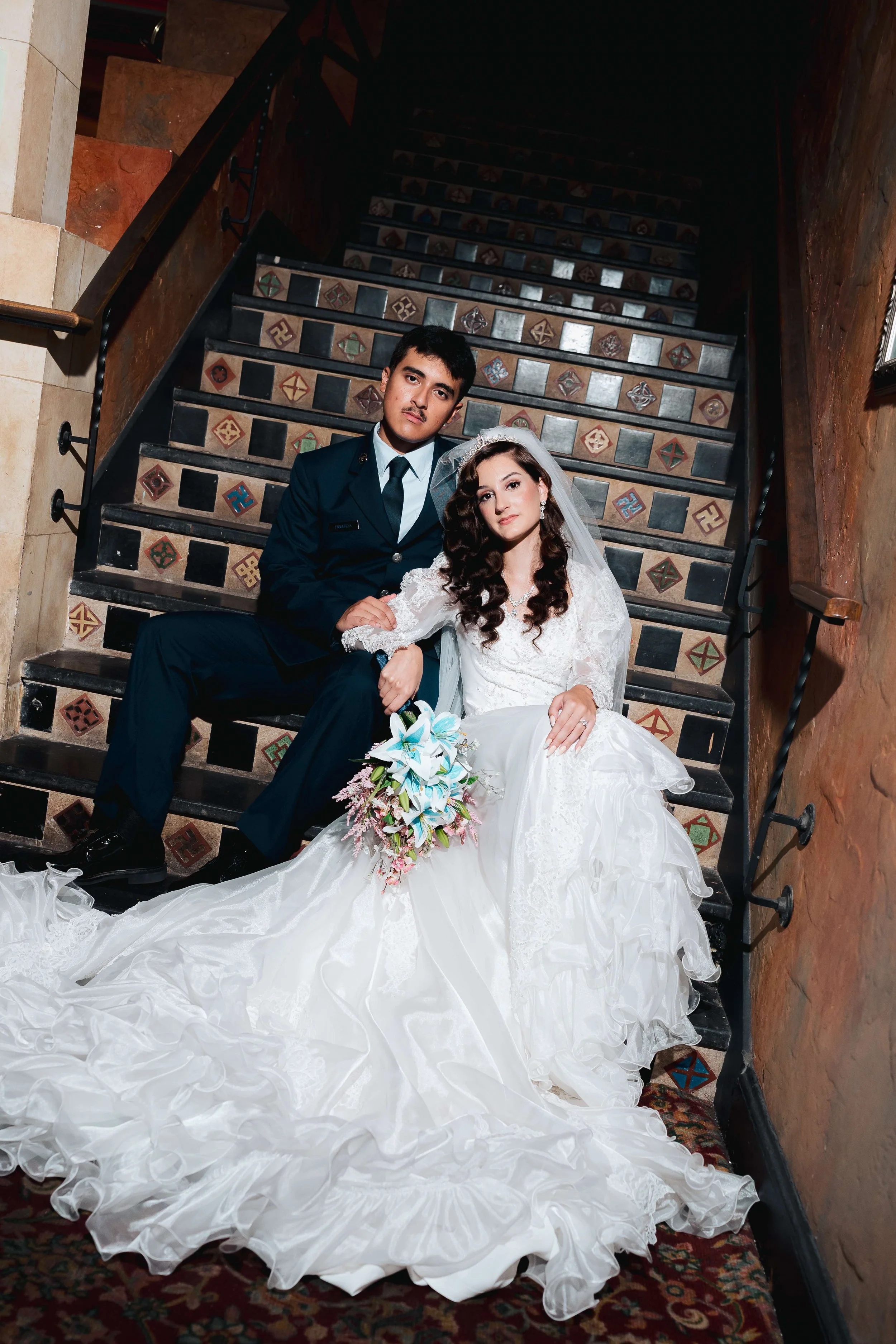 bride and groom on historic stairs