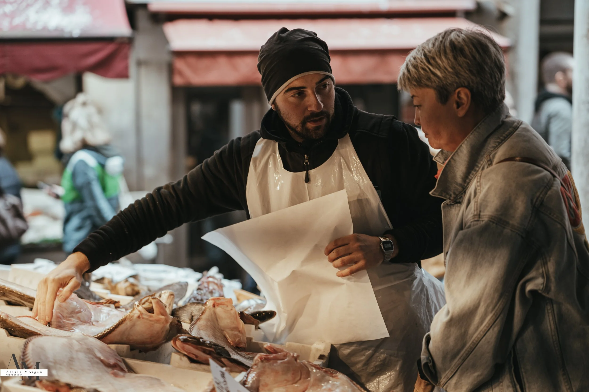 street photography, market, fish market Venice, Venice, Italy, Orlando, Florida, photographer, portrait, black and white photography, capturing moments, seagull with fish, fish, market