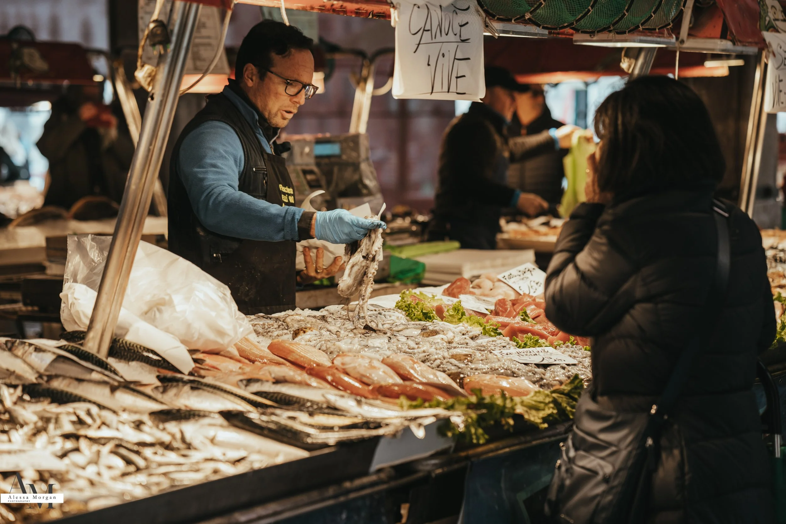 street photography, market, fish market Venice, Venice, Italy, Orlando, Florida, photographer, portrait, black and white photography, capturing moments, seagull with fish, fish, market