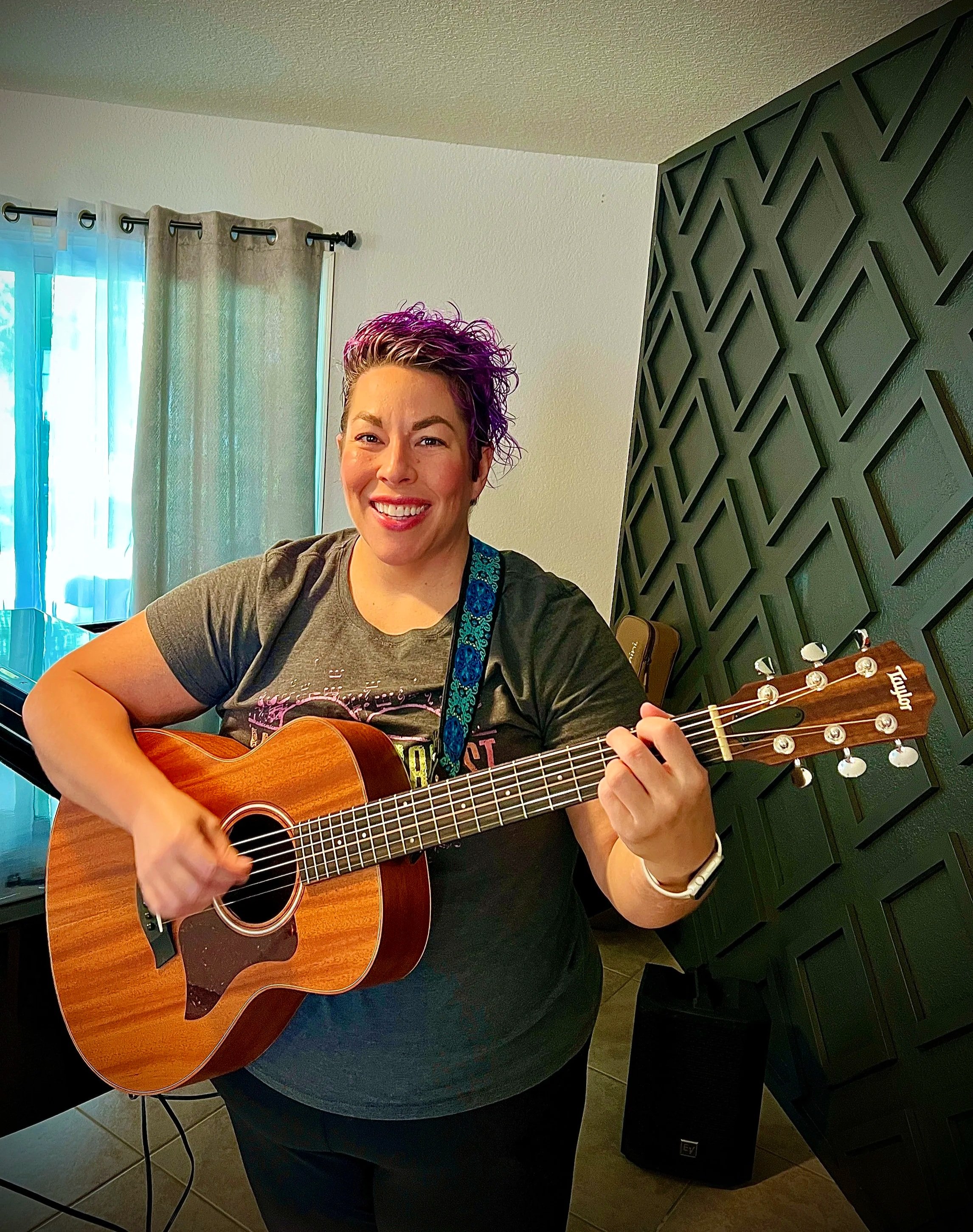 Female music therapist playing guitar