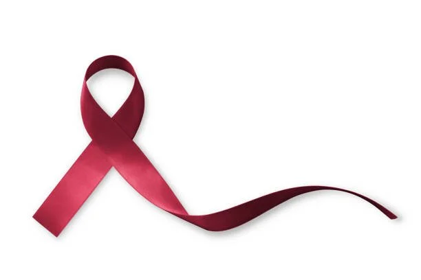 Maroon awareness ribbon on a plain white background.
