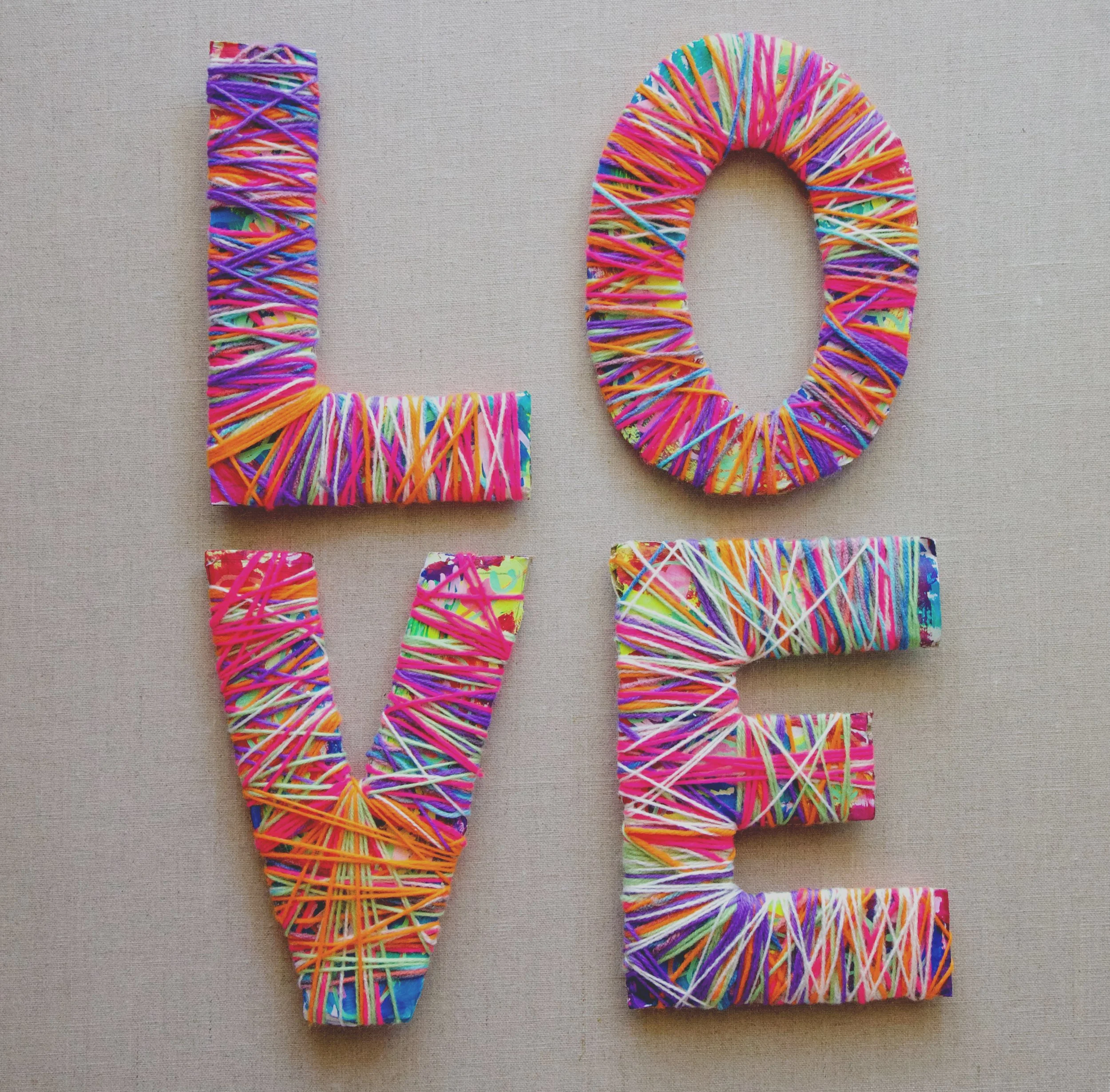 YARN WRAPPED WORDS ON THE WALL