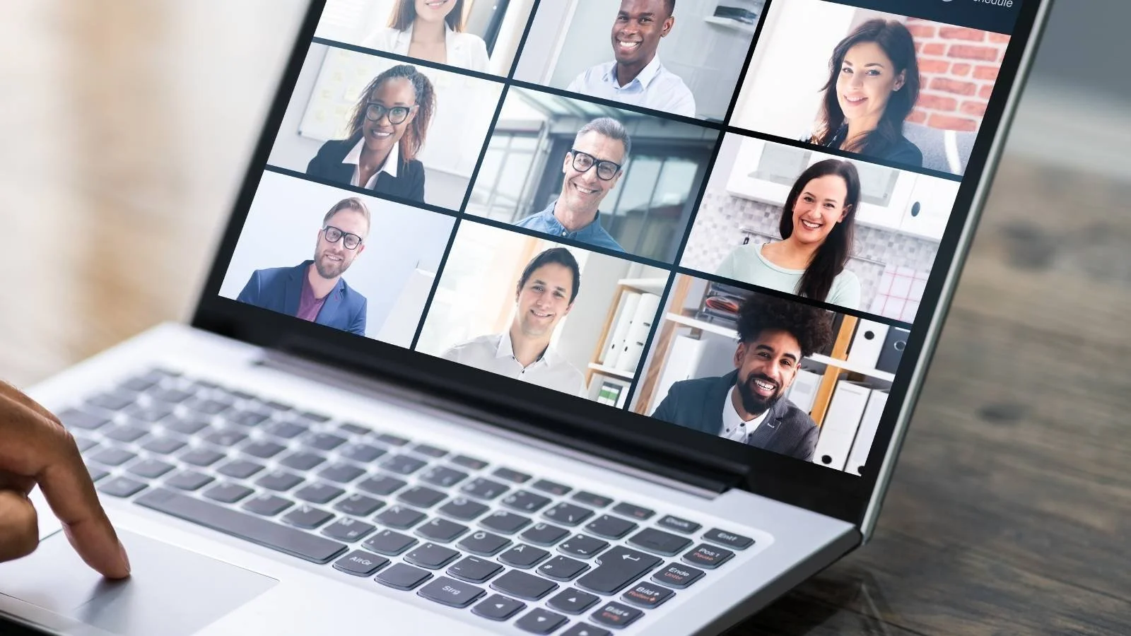 An image showing a laptop with multiple captured alumni stories