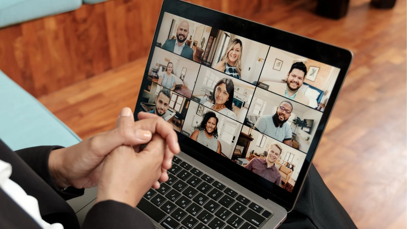 Capturing the voices of those that shaped your school. Laptop showing various alumni/community members