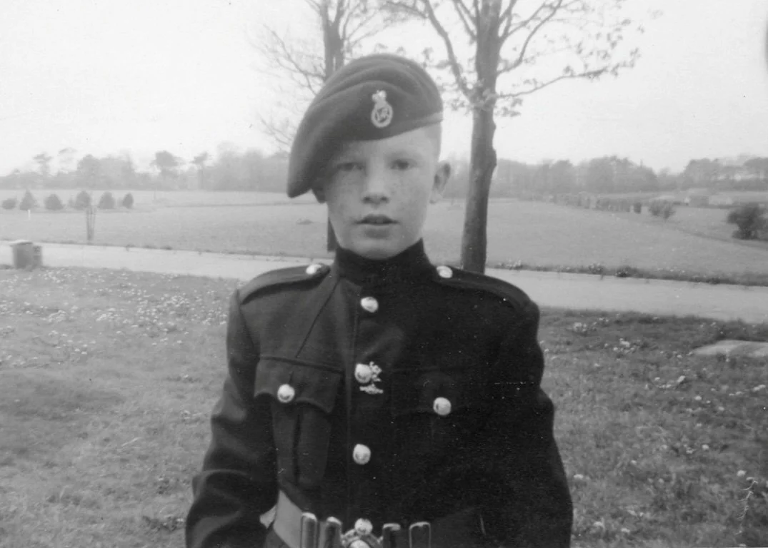 Black and white photo of a school boy in uniform representing personal memories and authentic storytelling in alumni engagement