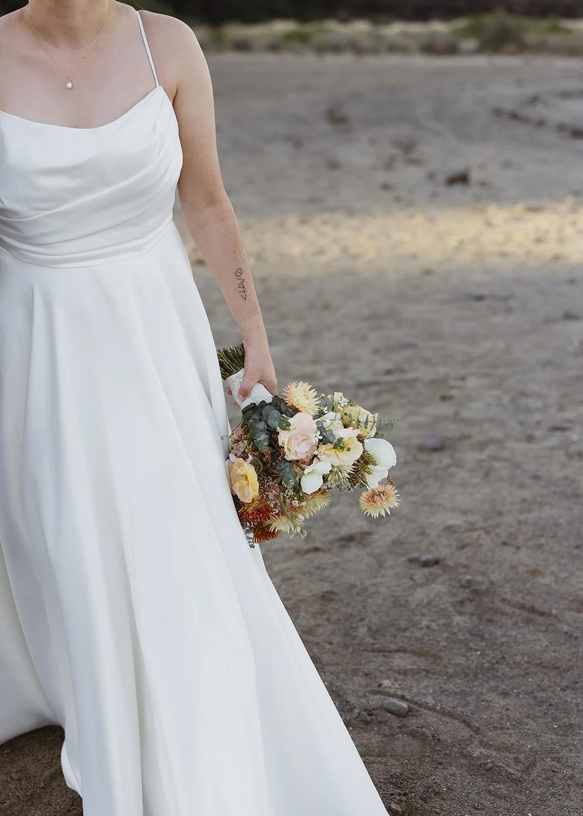Rustic and natural winter wedding in the Illawarra with native and whimsical cottage flowers. The couple celebrated with a ceremony at Figtree Anglican Church, scenic views at Cathedral Rocks, and reception at Ruby’s Mt. Kembla, combining seasonal bl