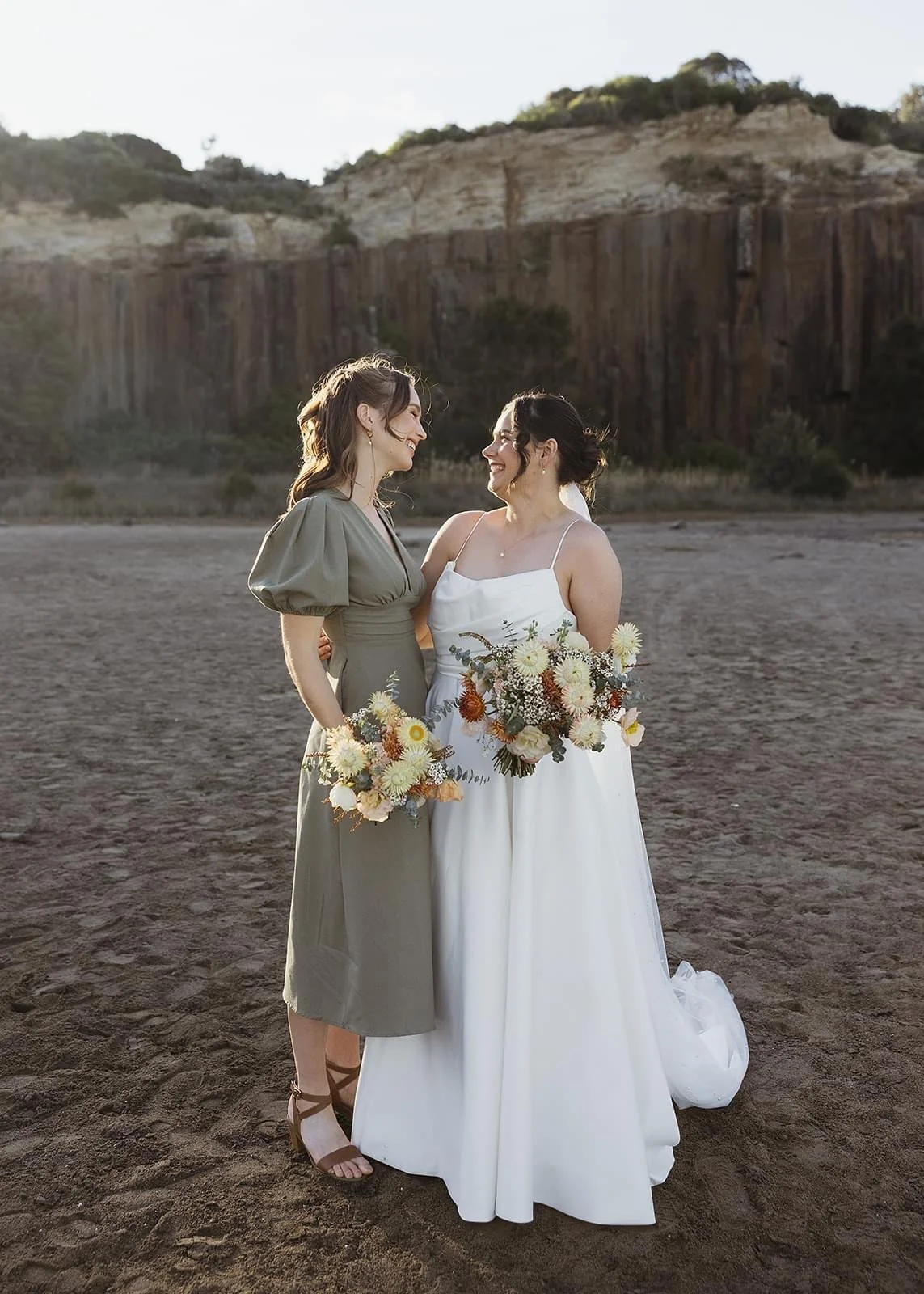 Rustic and natural winter wedding in the Illawarra with native and whimsical cottage flowers. The couple celebrated with a ceremony at Figtree Anglican Church, scenic views at Cathedral Rocks, and reception at Ruby’s Mt. Kembla, combining seasonal bl