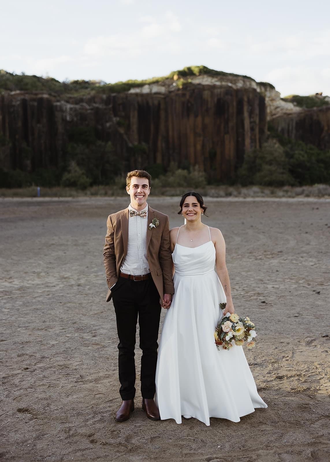 Rustic and natural winter wedding in the Illawarra with native and whimsical cottage flowers. The couple celebrated with a ceremony at Figtree Anglican Church, scenic views at Cathedral Rocks, and reception at Ruby’s Mt. Kembla, combining seasonal bl