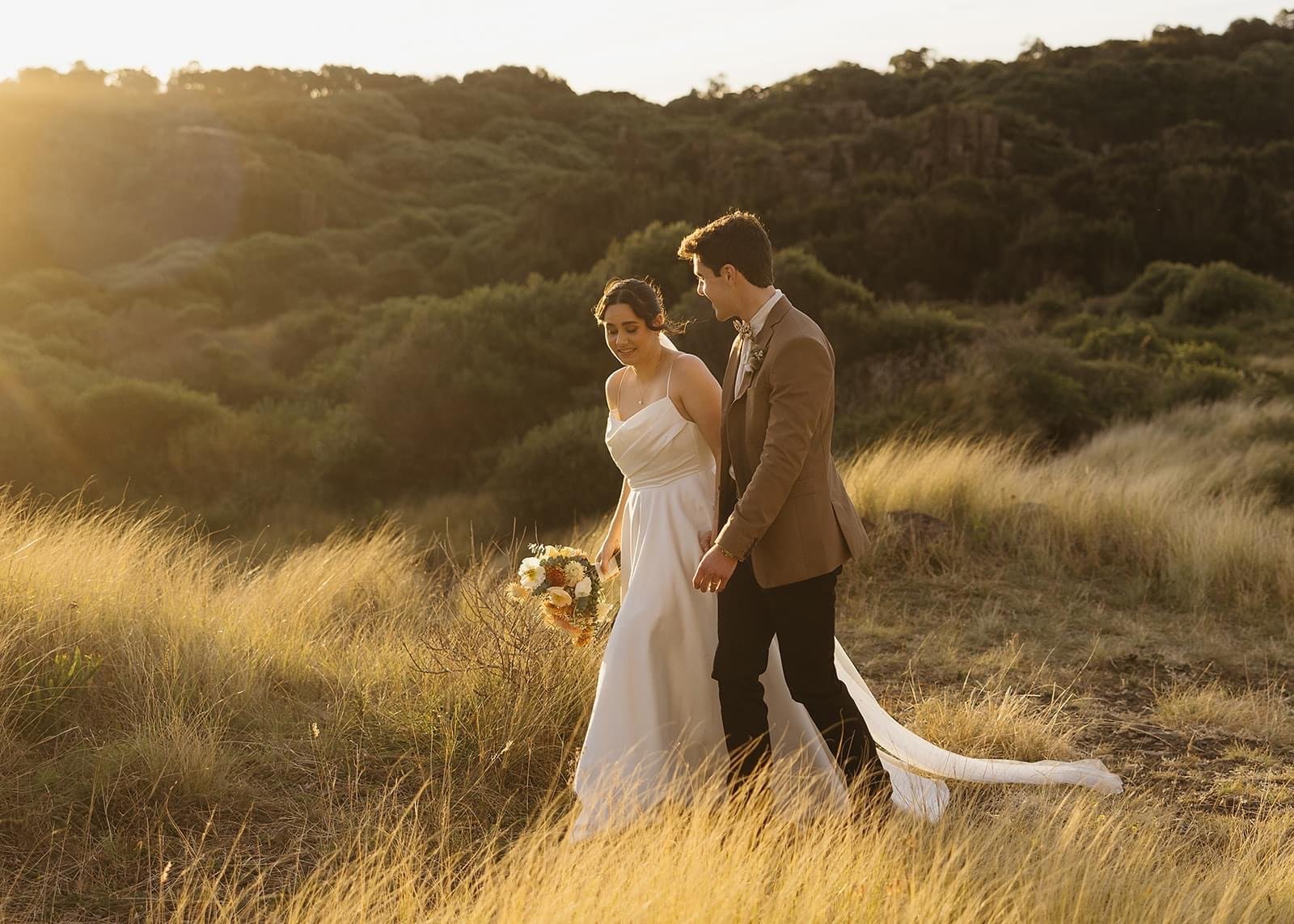 Rustic and natural winter wedding in the Illawarra with native and whimsical cottage flowers. The couple celebrated with a ceremony at Figtree Anglican Church, scenic views at Cathedral Rocks, and reception at Ruby’s Mt. Kembla, combining seasonal bl