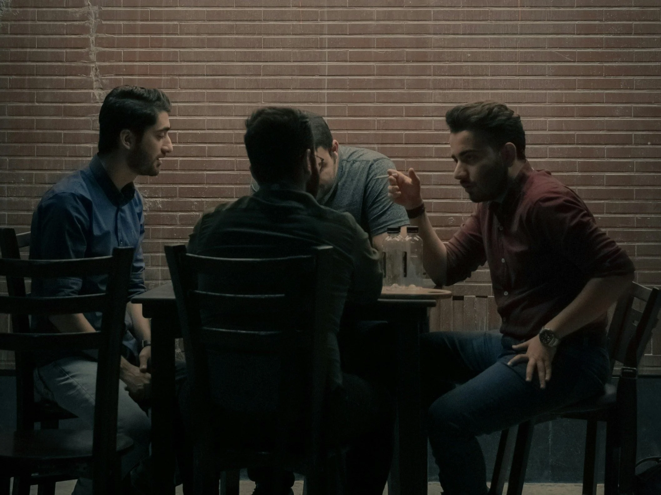 Adults enjoying conversation around a table