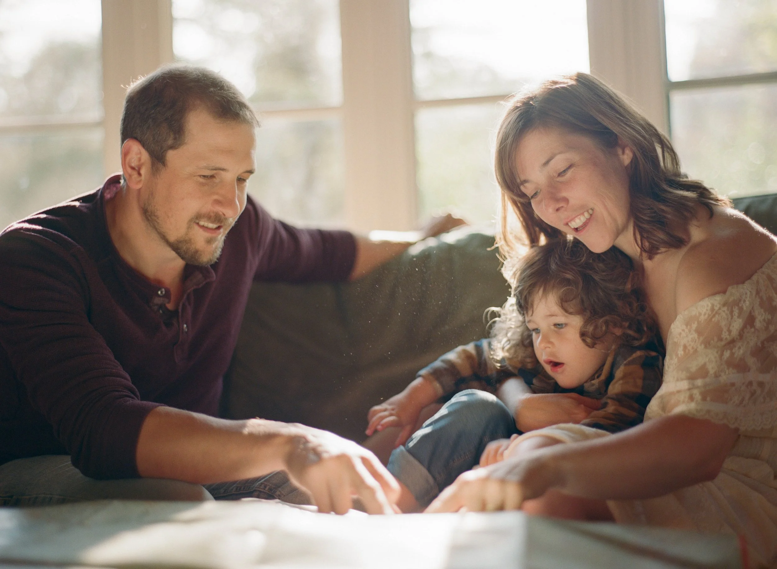 Joel Loughead with his family in their family home looking at a map in Grey Highlands