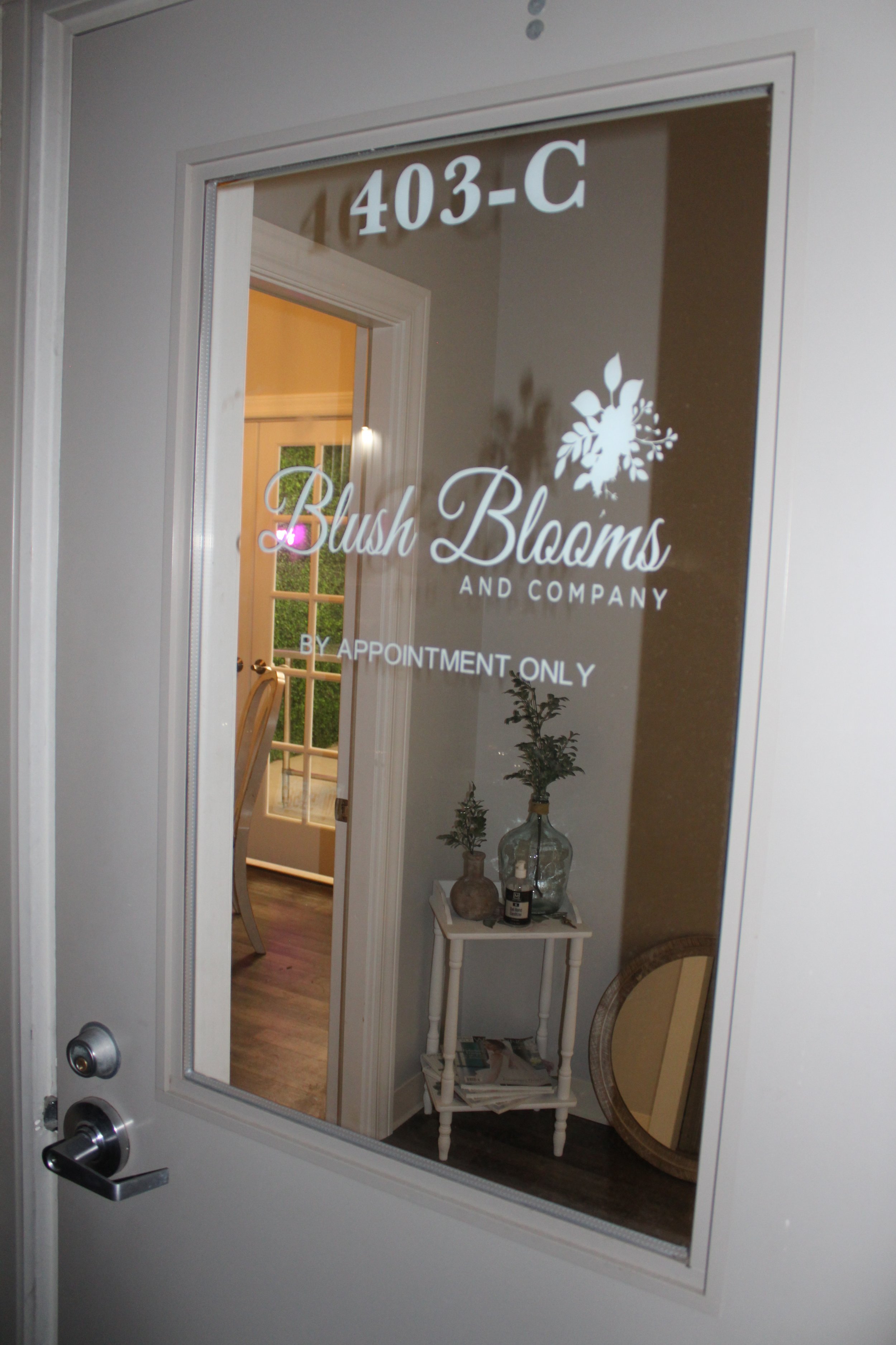 Door with "Blush Blooms and Company" logo and "By Appointment Only" text
