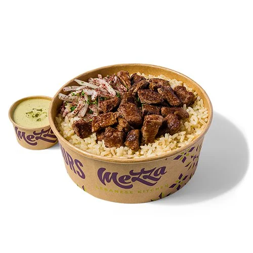 Steak Plate with brown rice, sumac onions and chimi-tahini sauce in a Mezza takeout container.