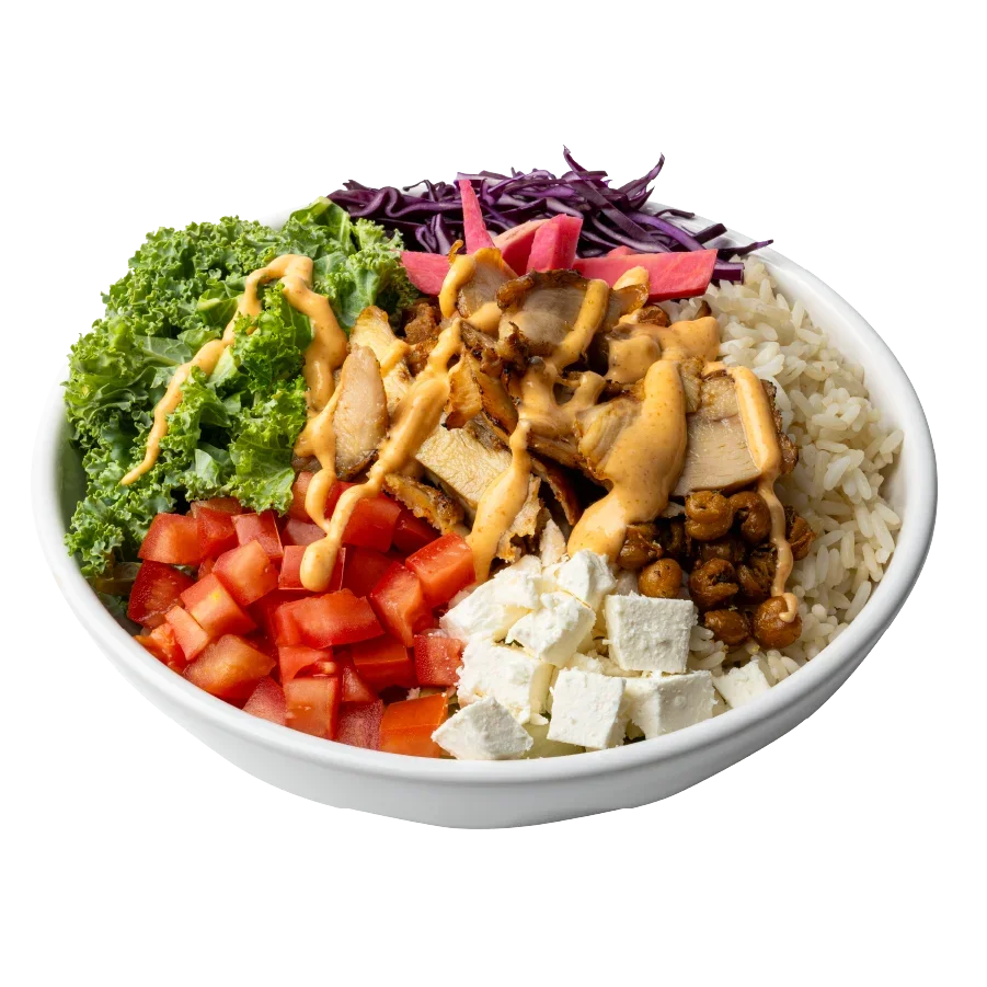 Bowl filled with delicious ingredients for a chicken and rice dish.