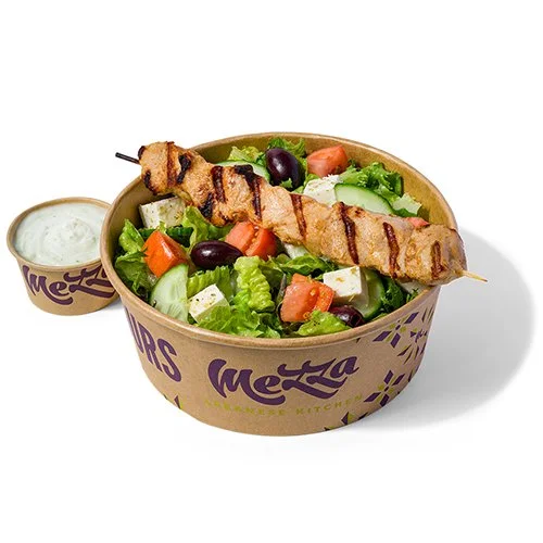 Chicken Souvlaki Lunch Plate with Greek salad and tzatziki sauce in a Mezza takeout container.