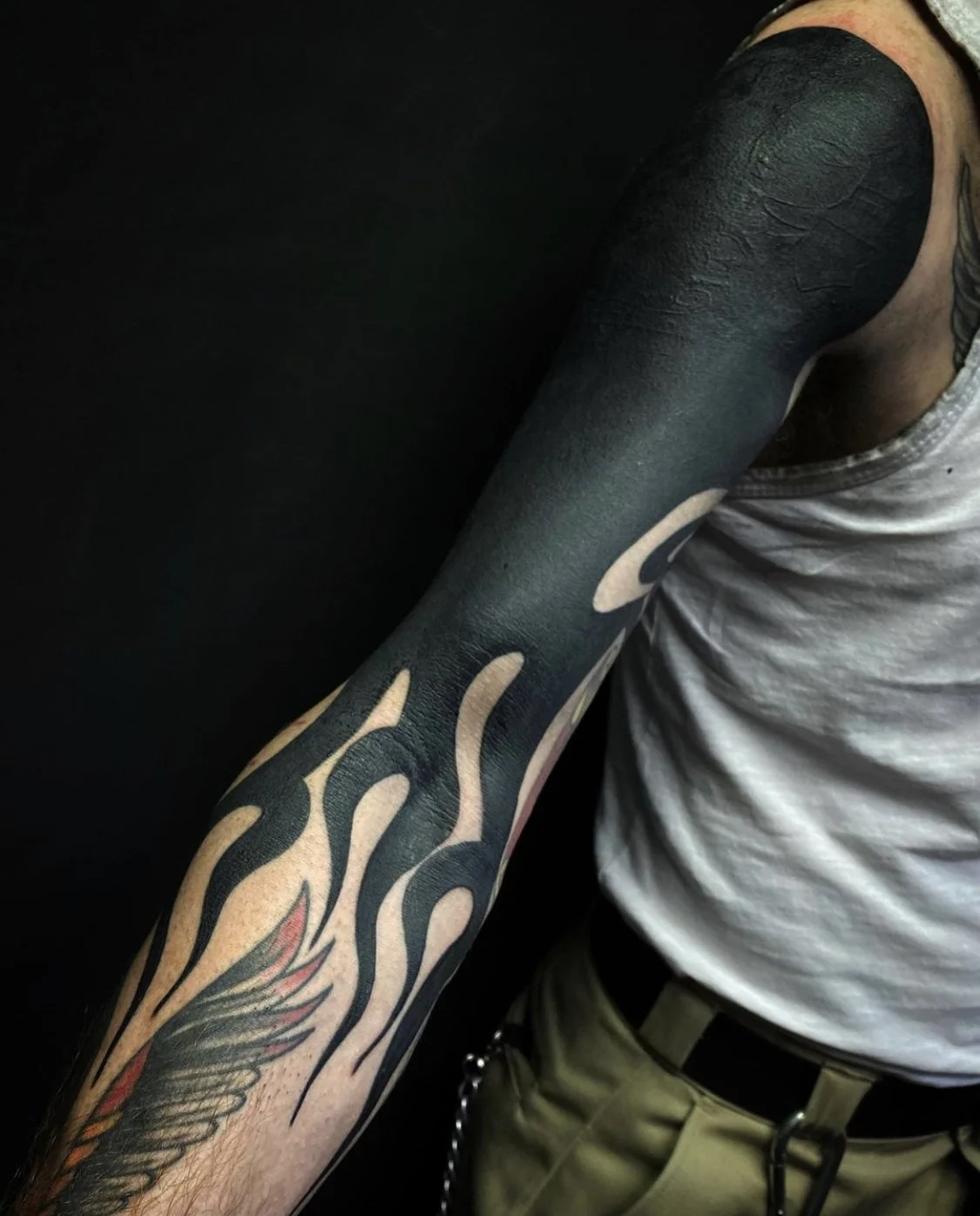 Blackout held sleeve, flames tattoo by Gormex, London tattoo artist