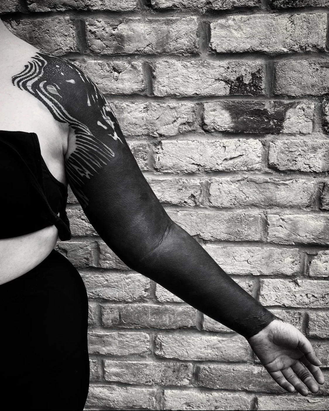 Blackout with Texture sleeve tattoo by Gormex, London tattoo artist