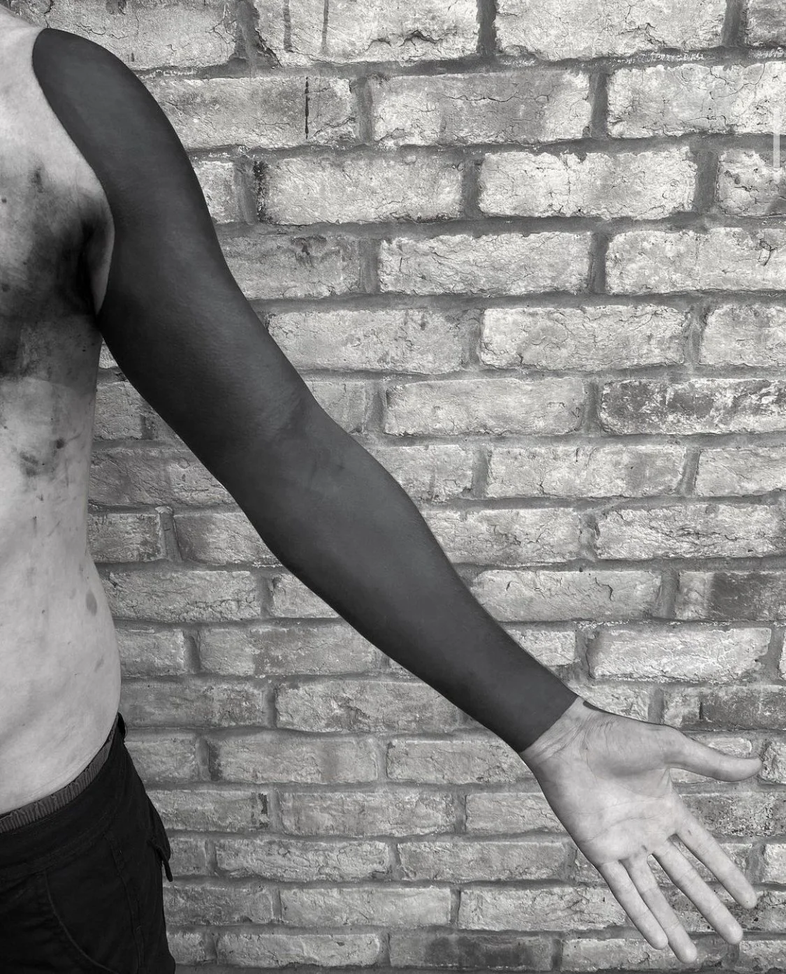 Blackout sleeve tattoo by Gormex, London tattoo artist