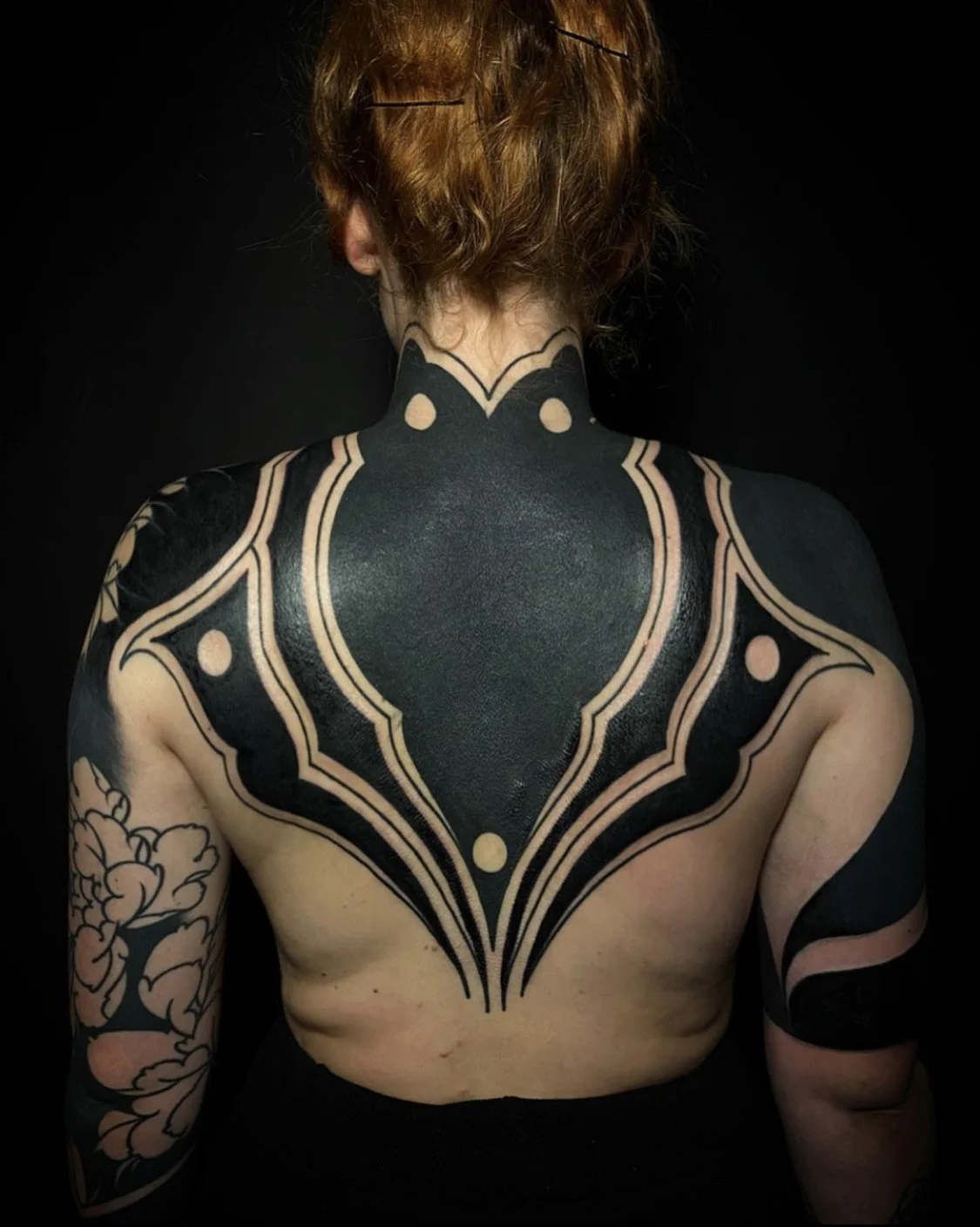 Blackout cover up half back tattoo by Gormex, London blackwork tattoo artist