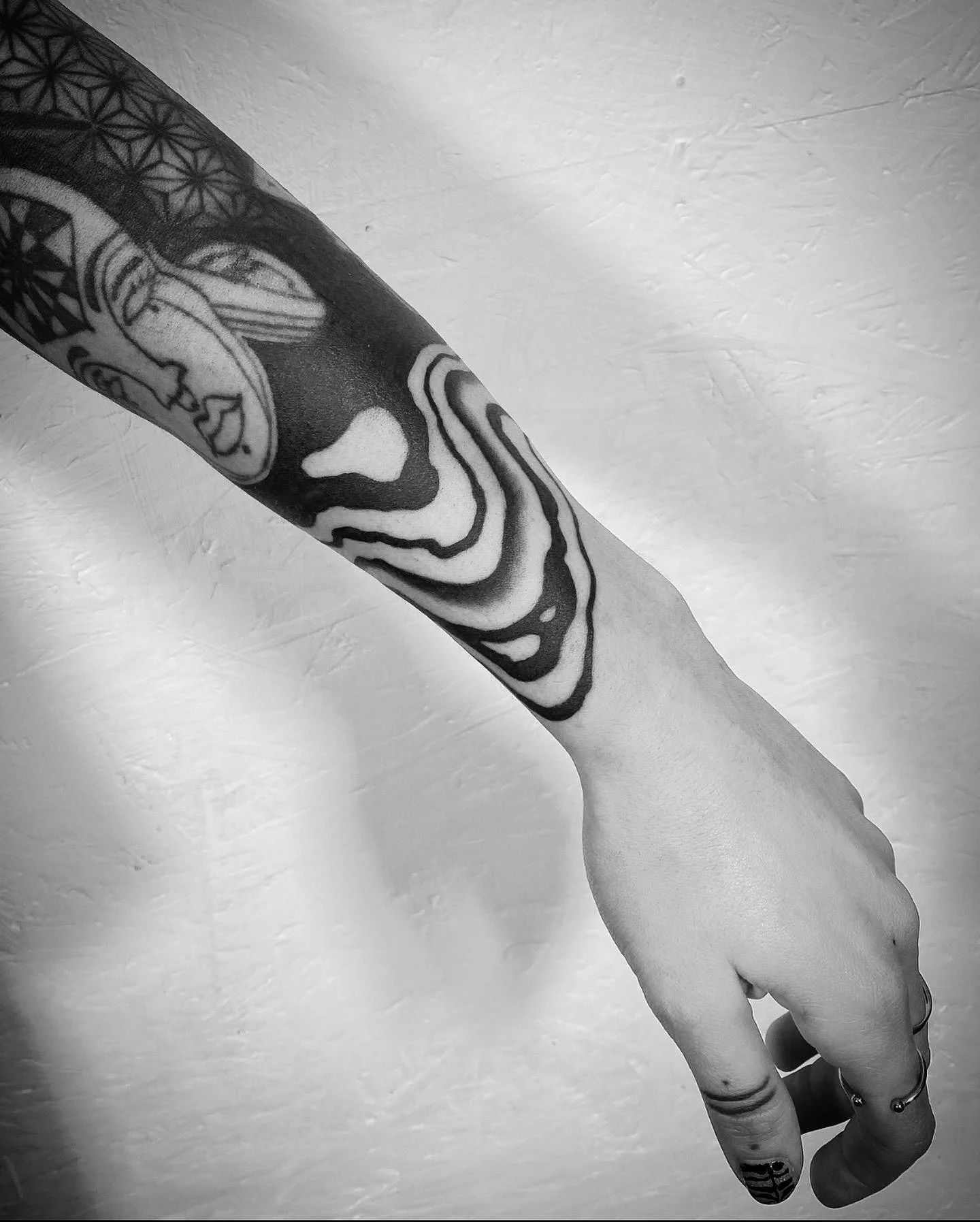 Blackwork suminagashi sleeve tattoo