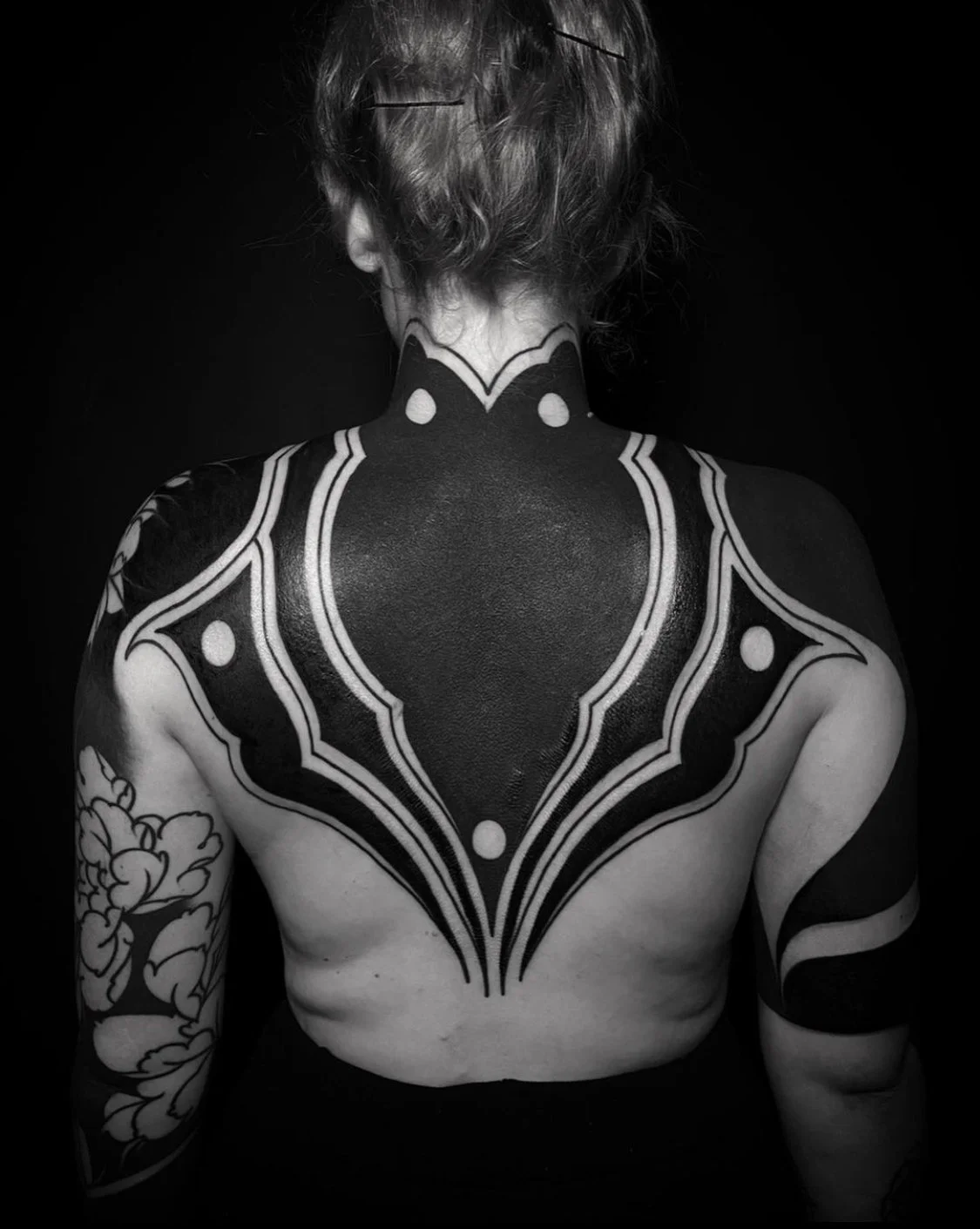 Blackout cover up half back tattoo by Gormex, London blackwork tattoo artist