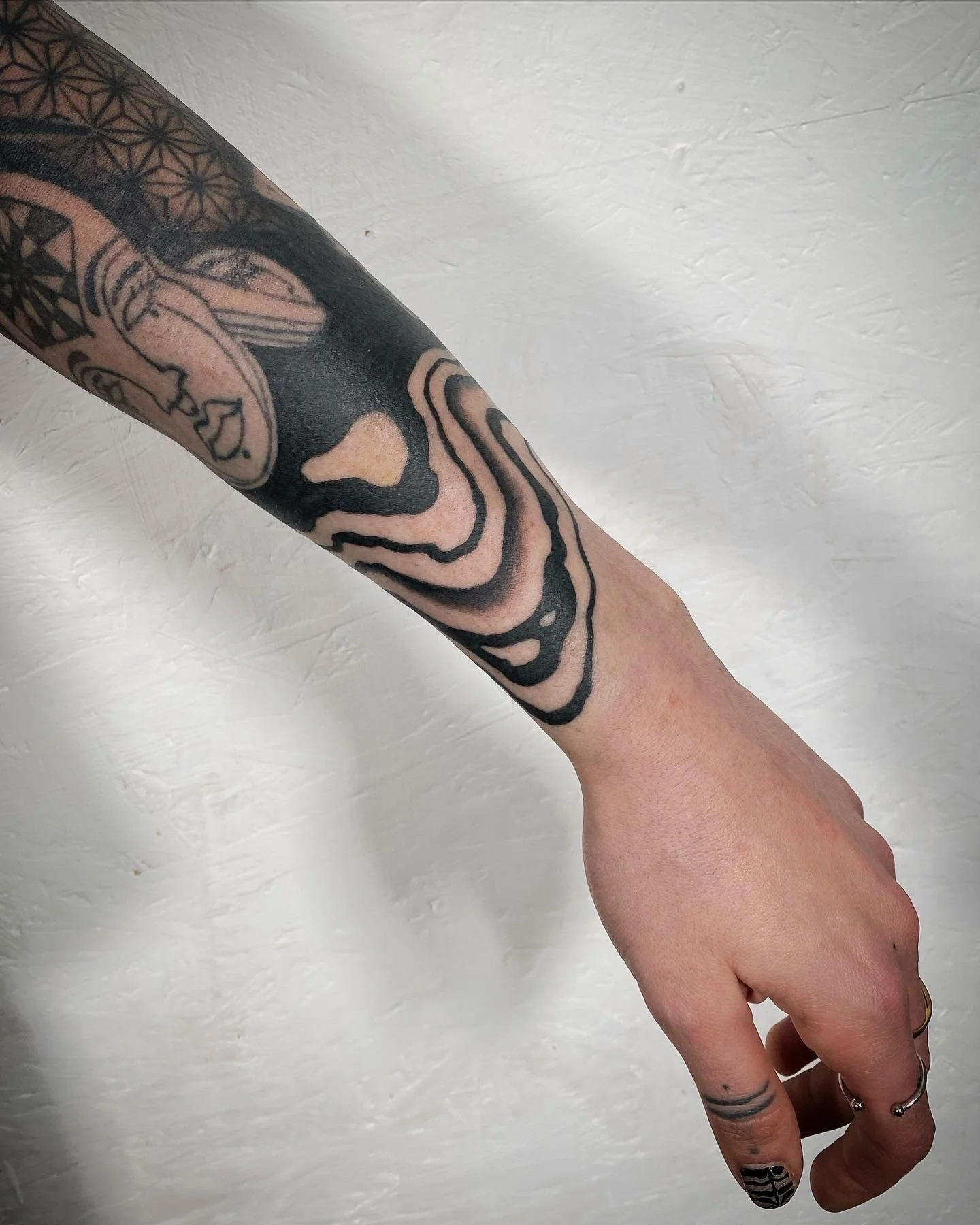 Black work suminagashi sleeve arm tattoo