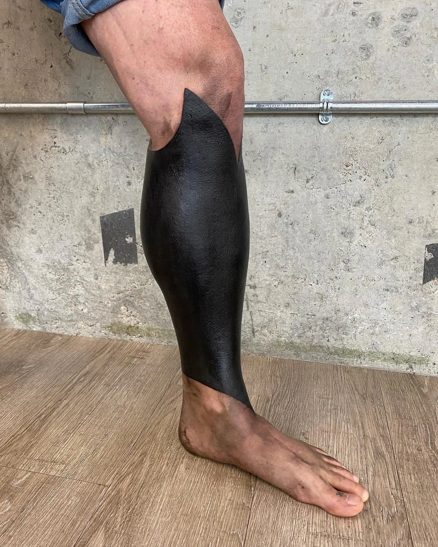 Blackout half leg sleeve cover up tattoo by GÖRMEX, London blackwork tattoo artist, difficult cover up