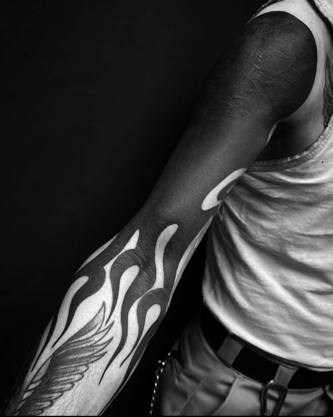 Blackout held sleeve, flames tattoo by Gormex, London tattoo artist