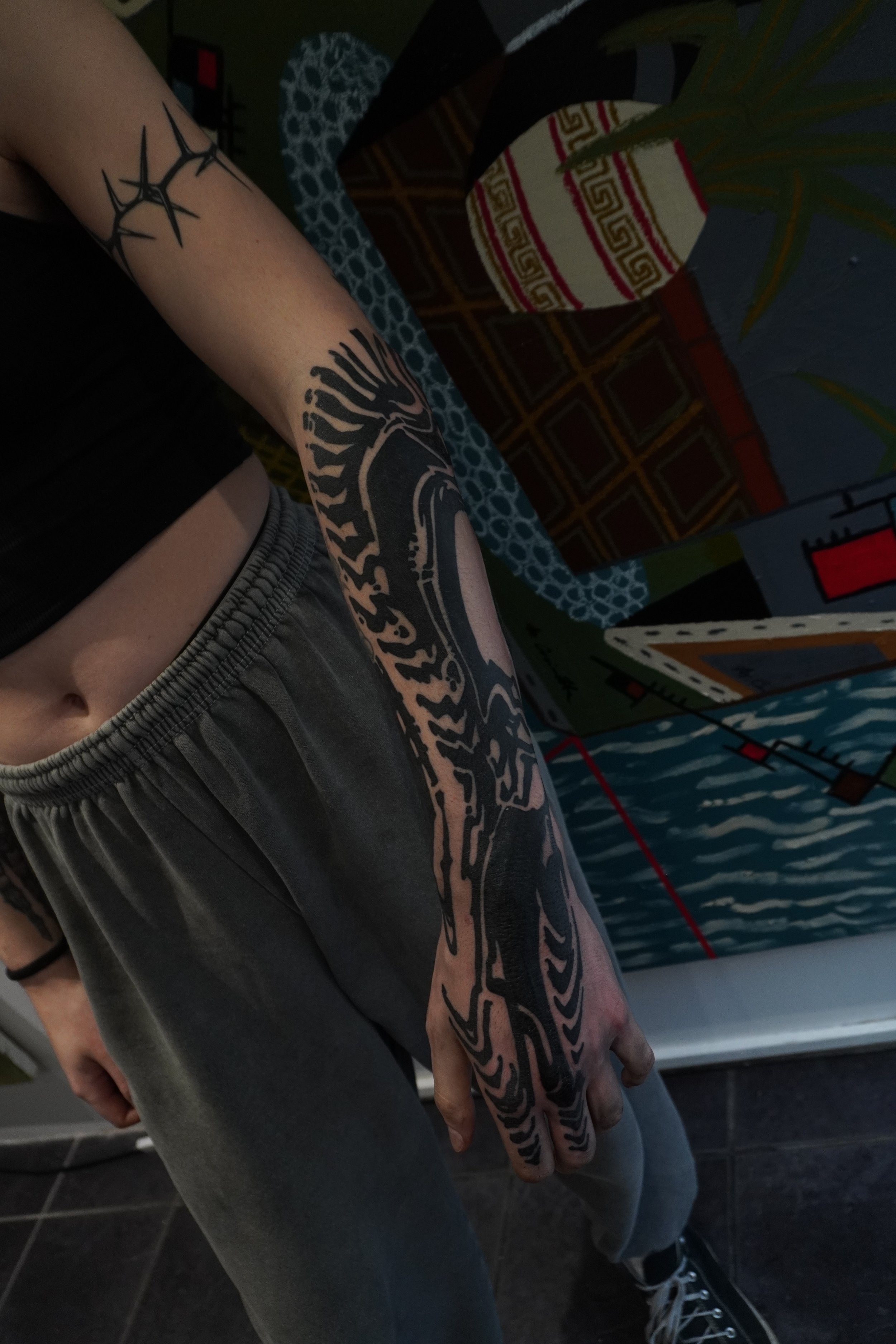 Abstract Blackwork half sleeve and hand, fingers with distorted patterns and textures. Done by Görmex in London at seven Doors Tattoo