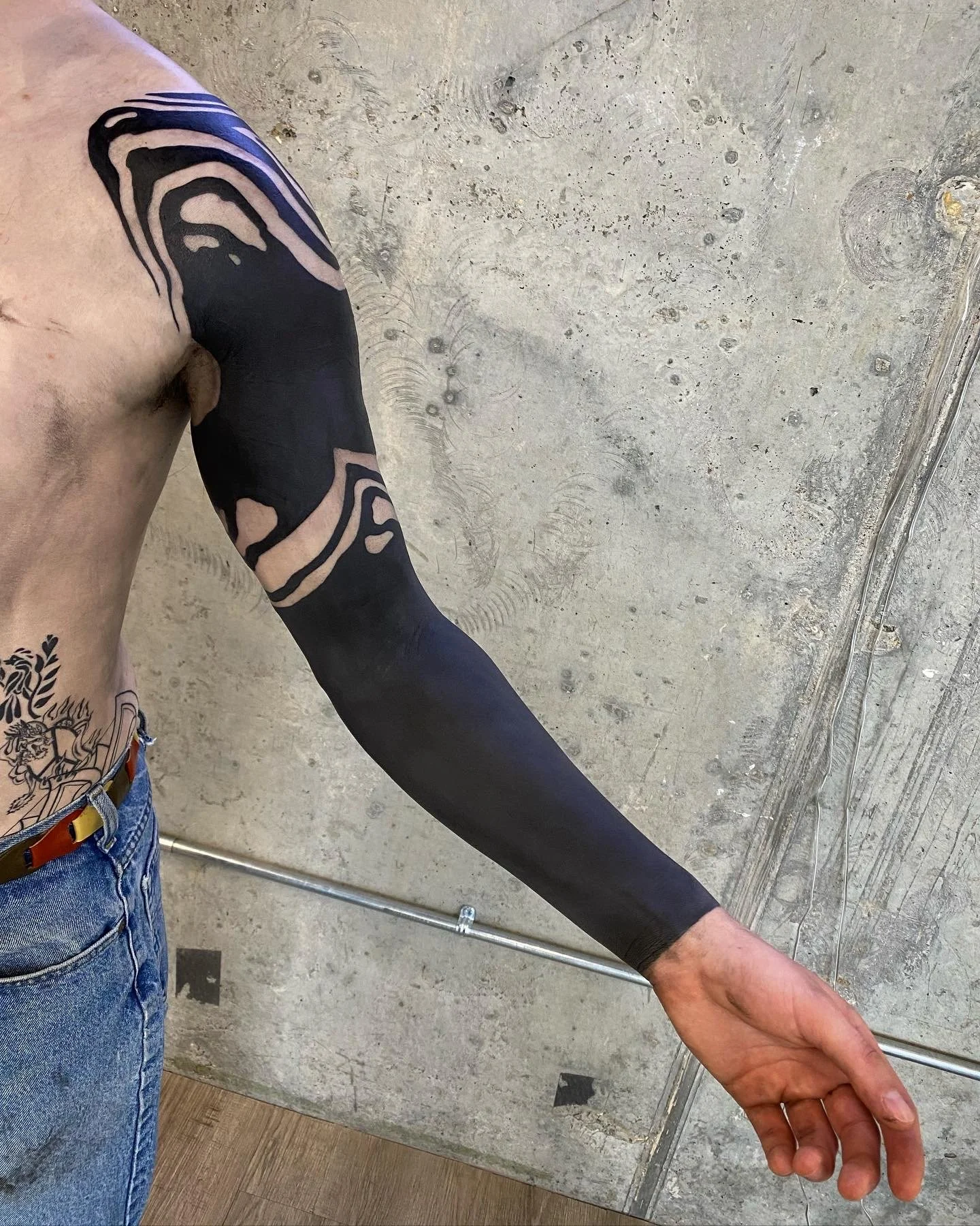 Blackout sleeve cover up tattoo by GÖRMEX, London blackwork tattoo artist, difficult cover up