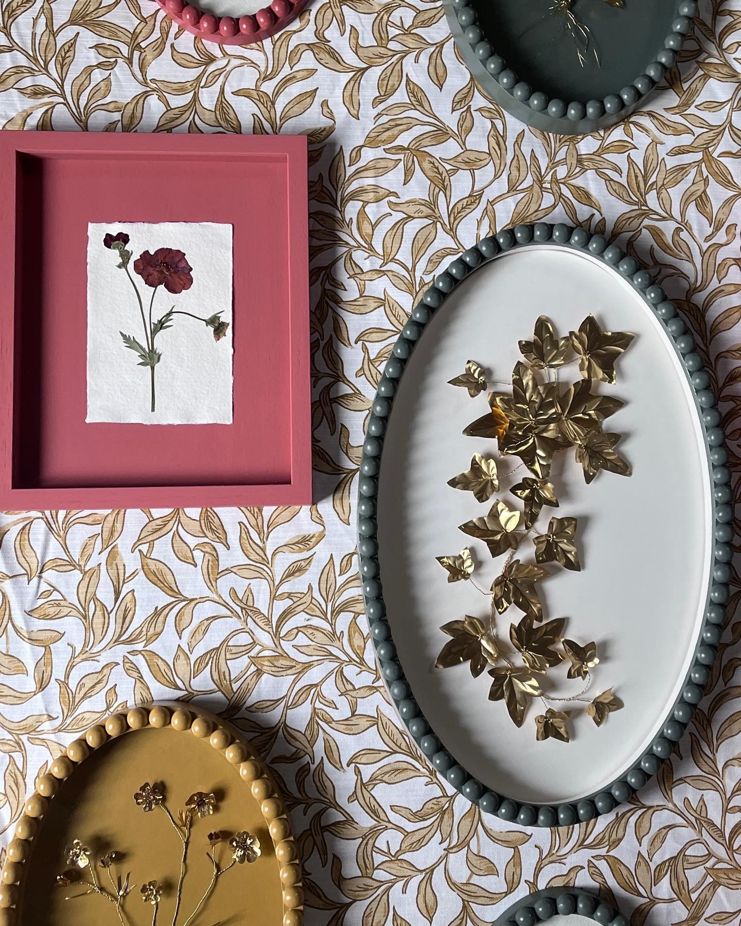 New collection incoming! 
✨✨Launching 15th April✨✨

A mix of brass and pressed flowers from my garden. Photographed in the darkness that is supposed to be spring&hellip; 

Just three key colours- Brunswick green ( Edward Bulmer) India Yellow (farrow 