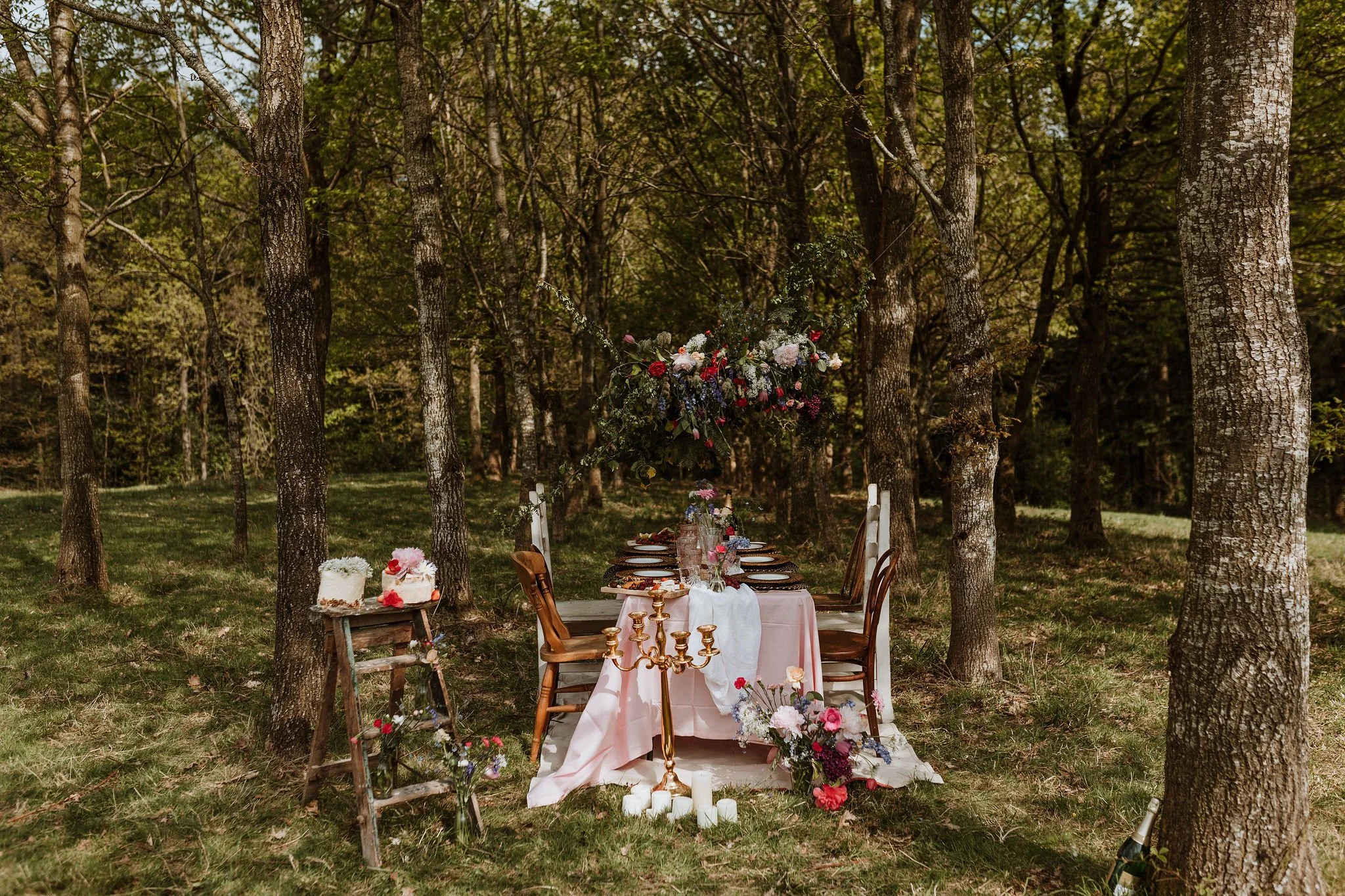 summer haven, pink flowers, candles, 2 cakes pink and white, forest table