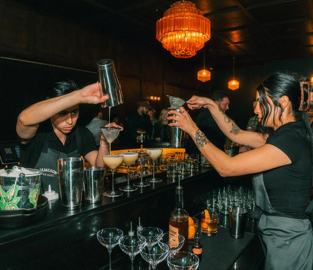 Bartender making a cocktail at the bar during an event