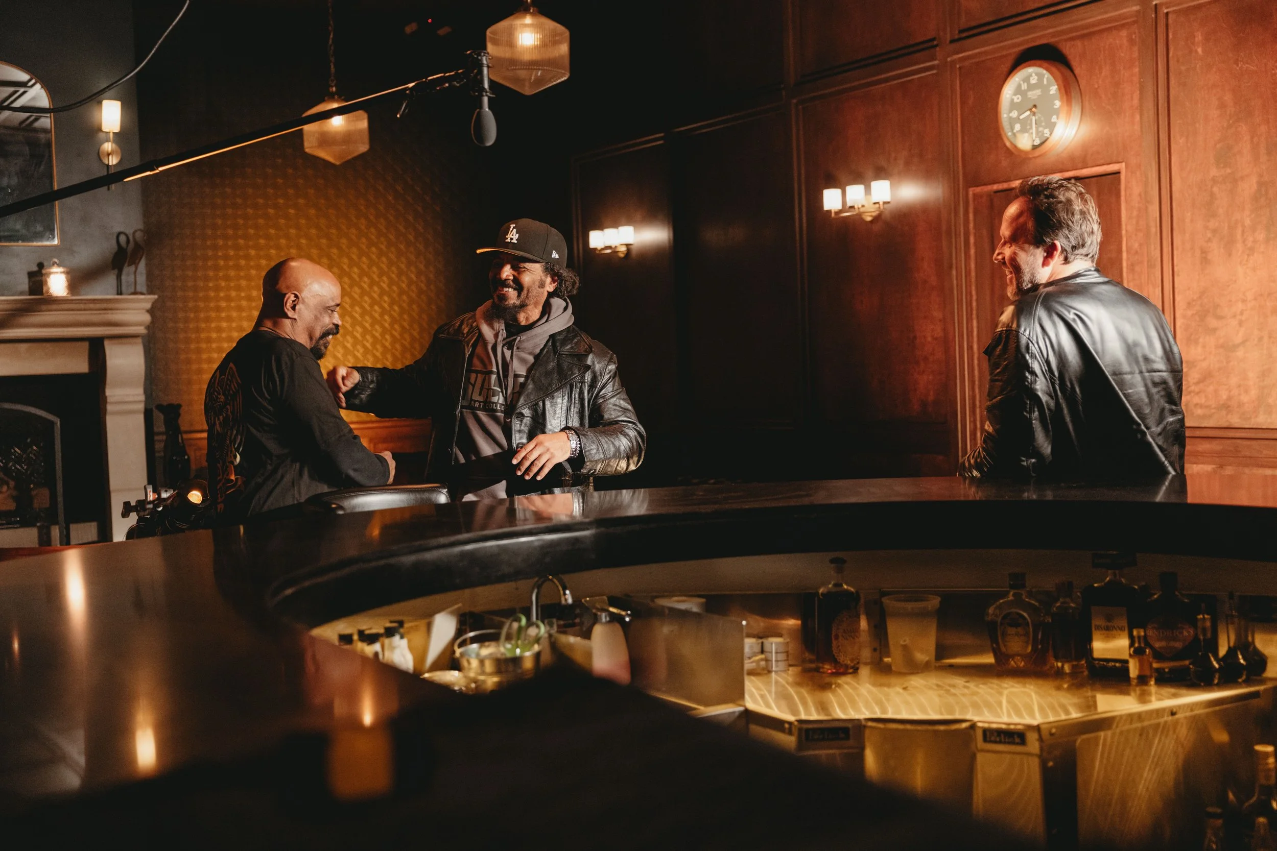 Tow people smiling and embracing at the bar during an event