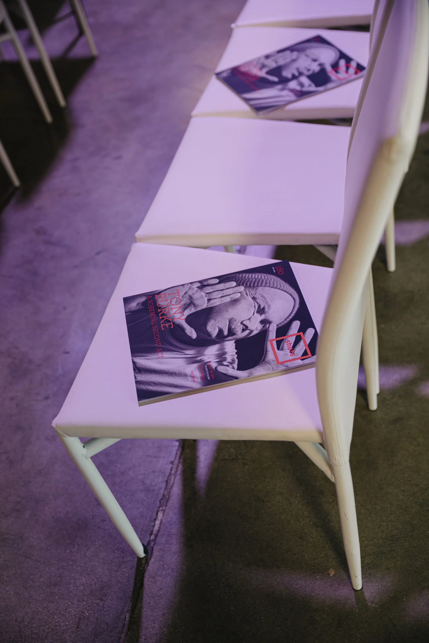 Artistic image of a magazine laid on a chair during a panel talk event at Bike Shed Moto LA
