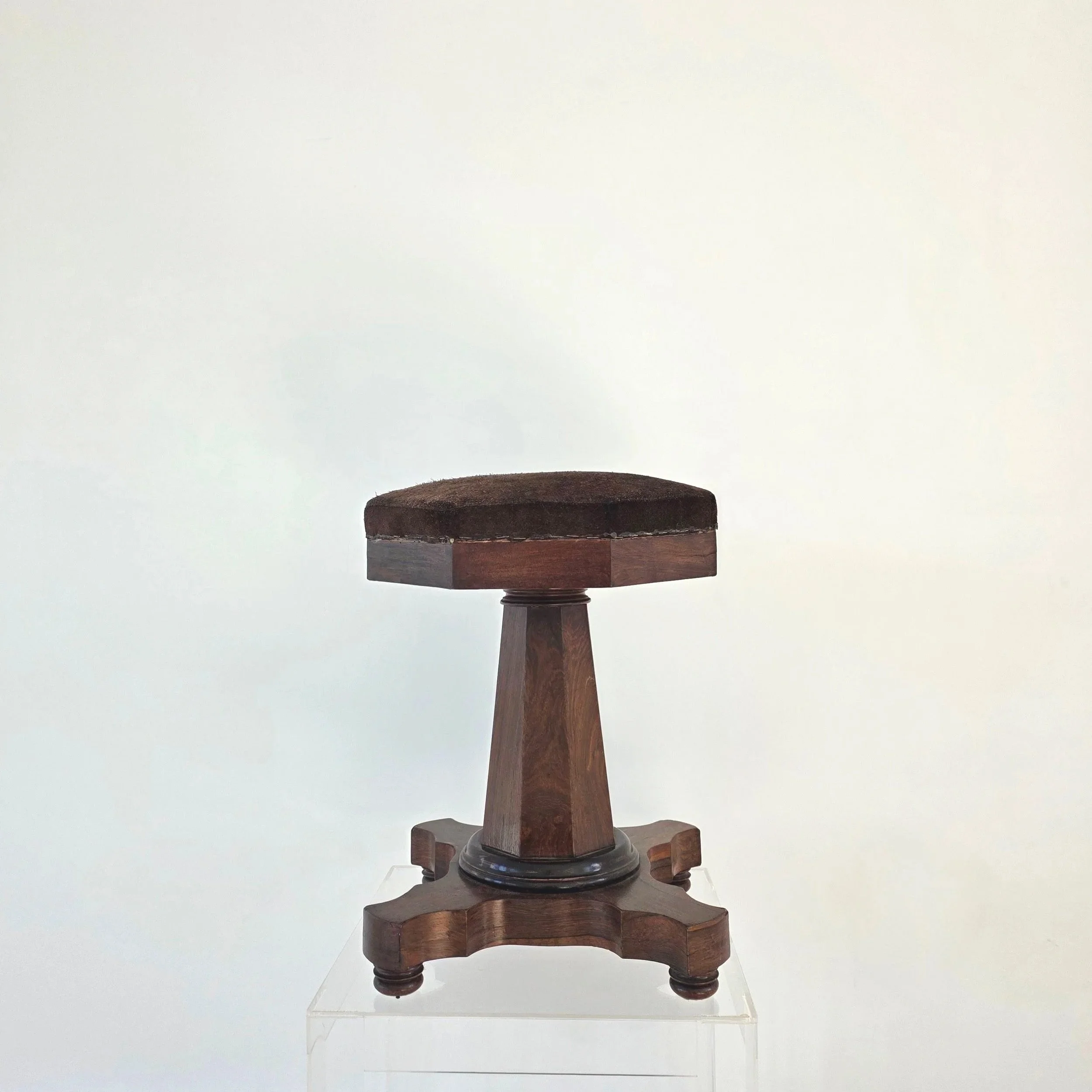 19th-century American Empire mahogany swivel, octagonal piano stool in suede, c. 1840's.  Condition of wood: good/wear consistent with age and use.  Condition of swivel mechanical: excellent.  14" w x 21" t.