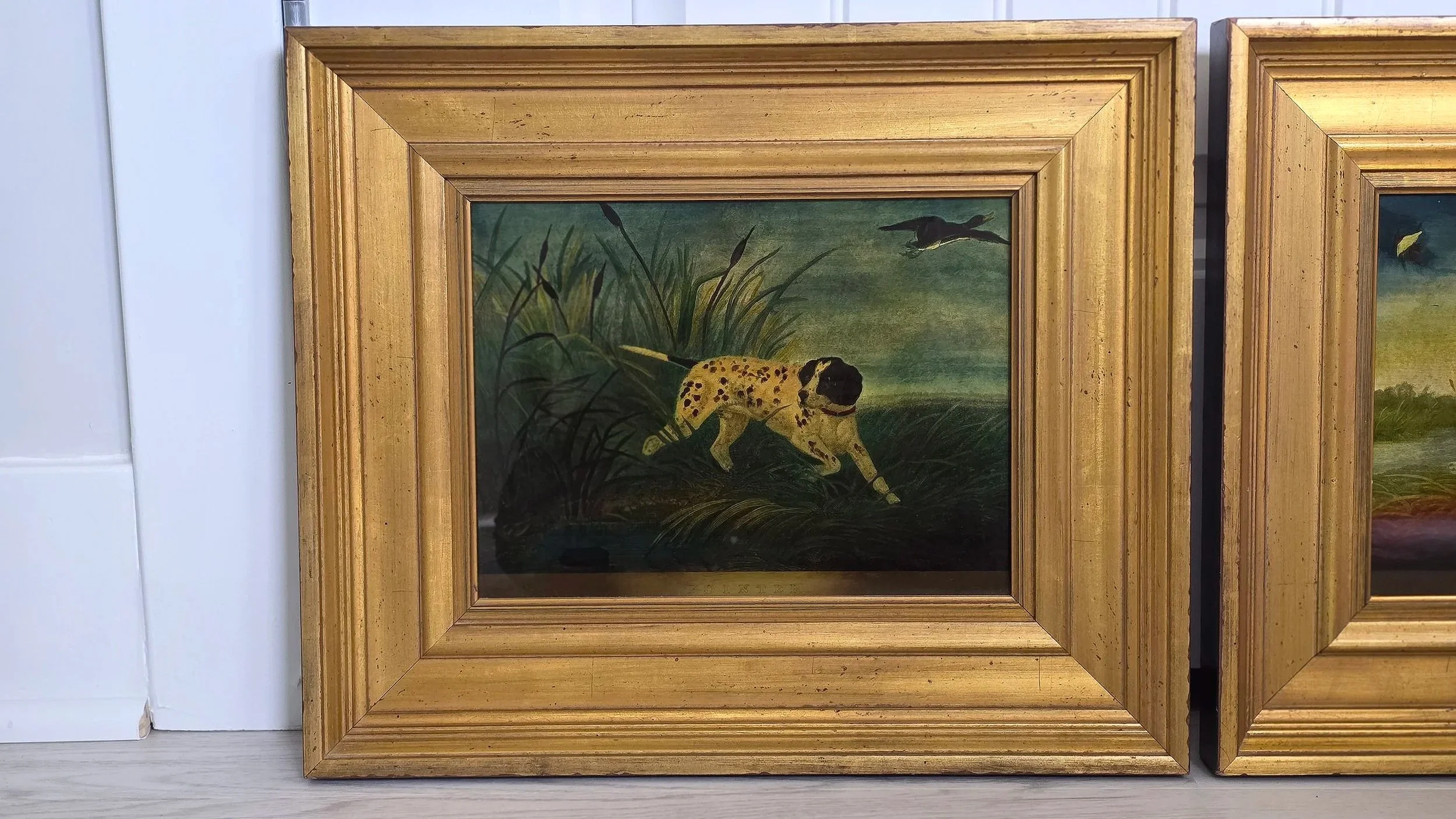 One of a pair of framed, eglomise hunting scenes.  Late twentieth century.