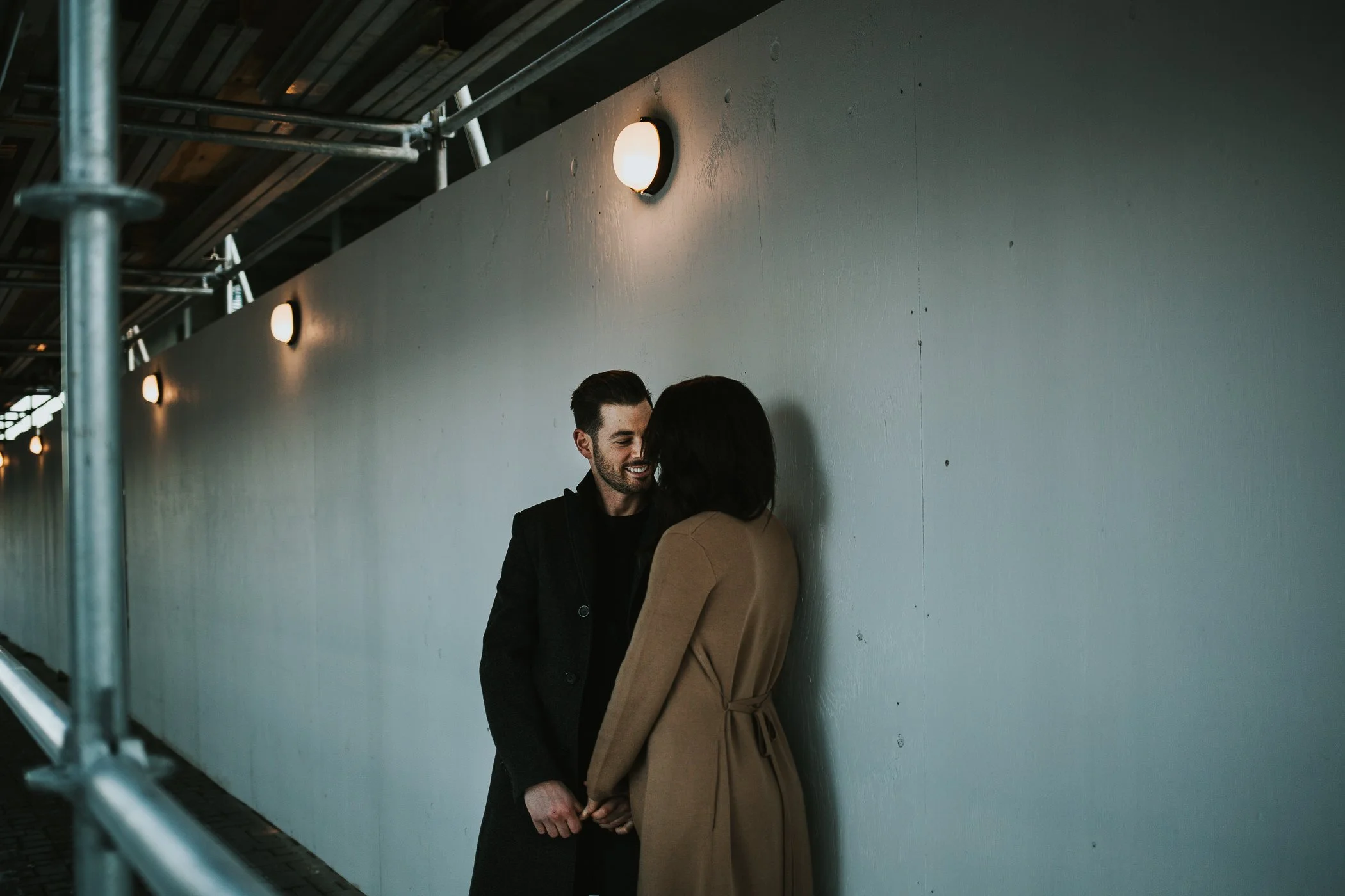 Couple kissing under street light in downtown Calgary 