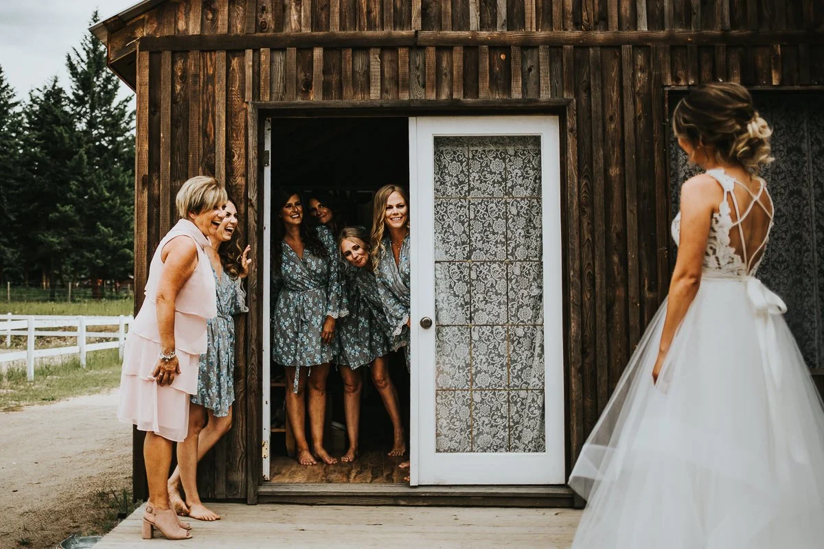 Bridesmaids first look with bride in her Blush by Hailey Paige wedding dress