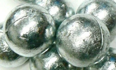 Close-up of shiny, metallic rocks with rough texture and irregular shapes.