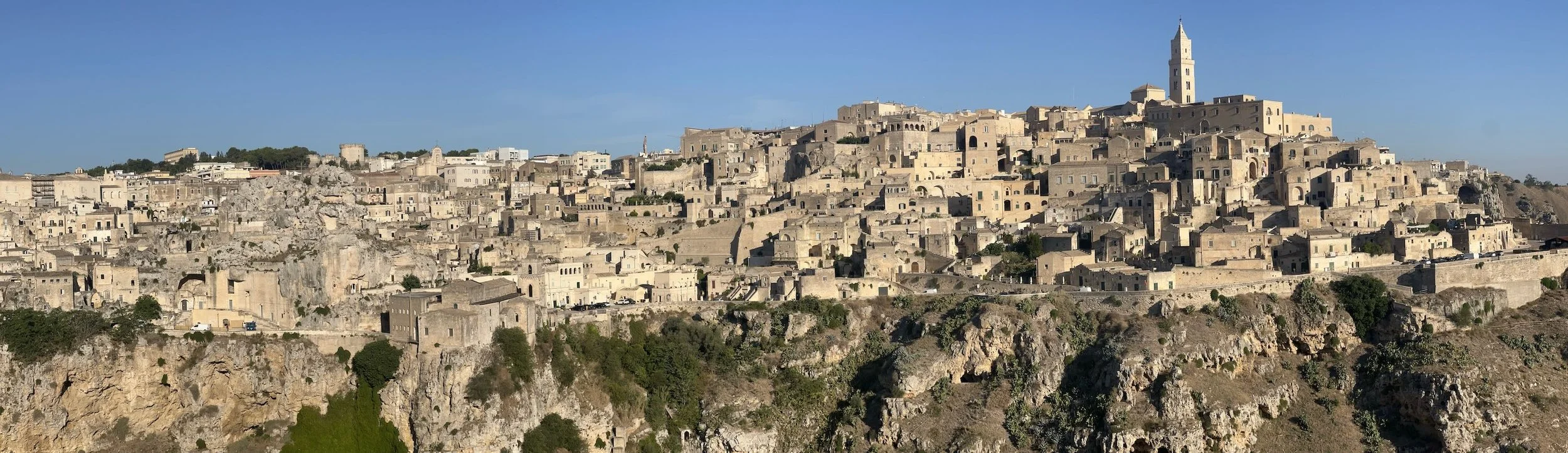 Matera, perched on a rocky hillside in Basilicata, southern Italy, is one of the world’s oldest continuously inhabited cities. Go there and stay in a converted cave. Hike across the valley in the morning.