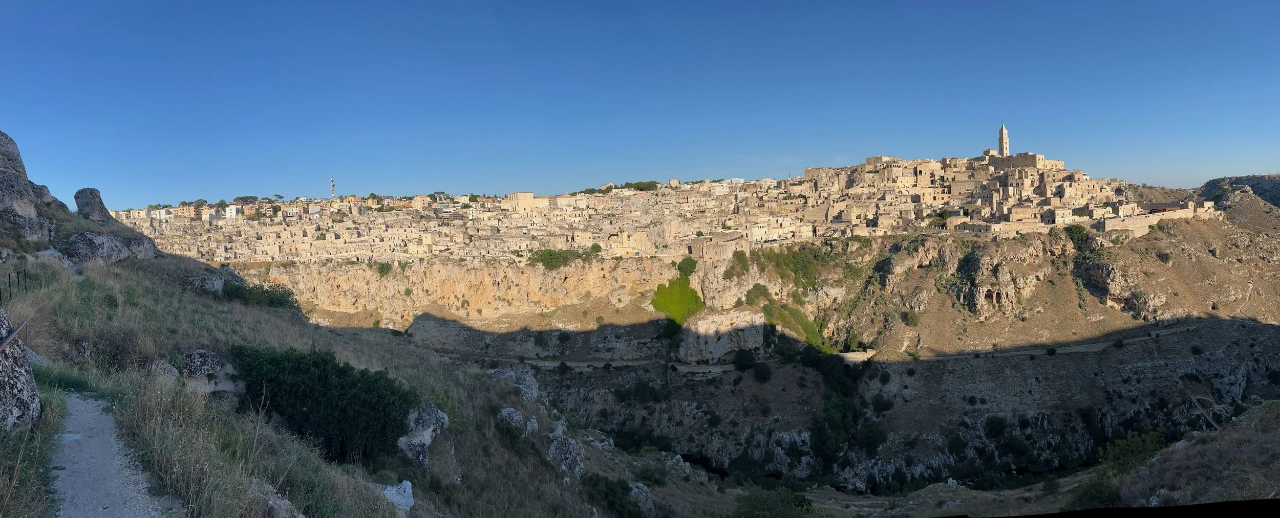 Matera, perched on a rocky hillside in Basilicata, southern Italy, is one of the world’s oldest continuously inhabited cities. Go there and stay in a converted cave. Hike across the valley in the morning.