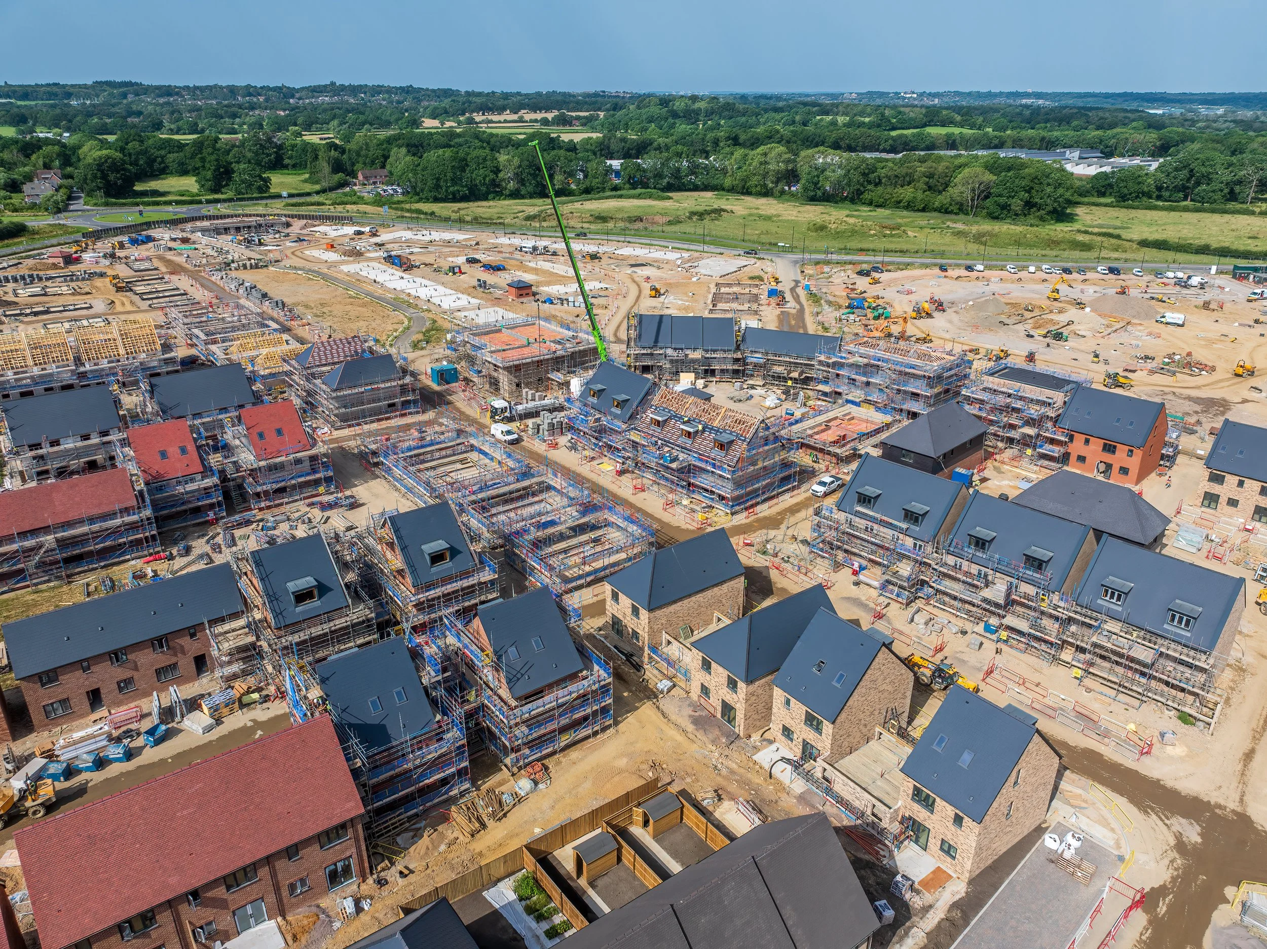 Aerial drone view showing construction progress across housing development