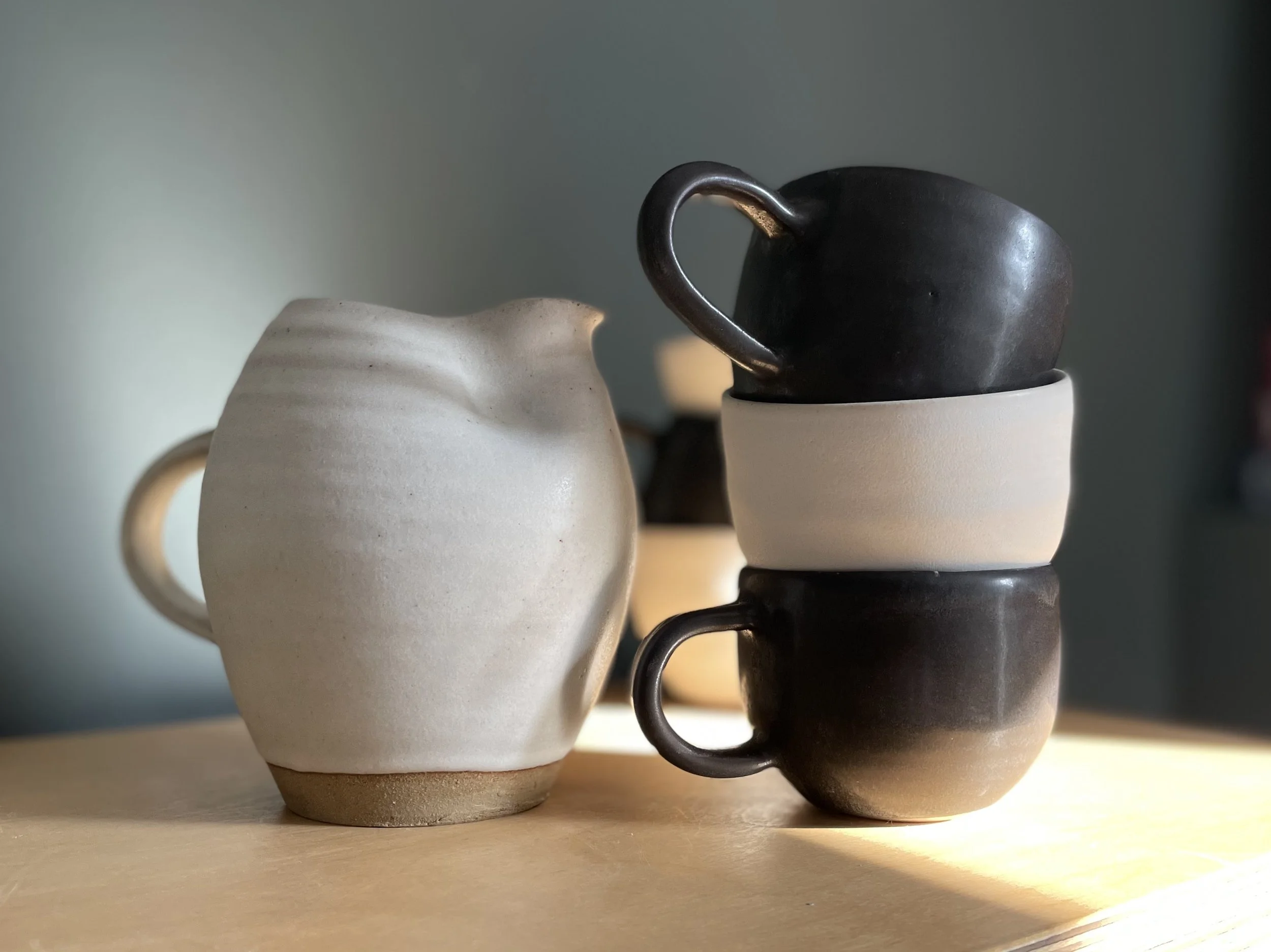 Squeezed jug w:coffee cups.jpeg