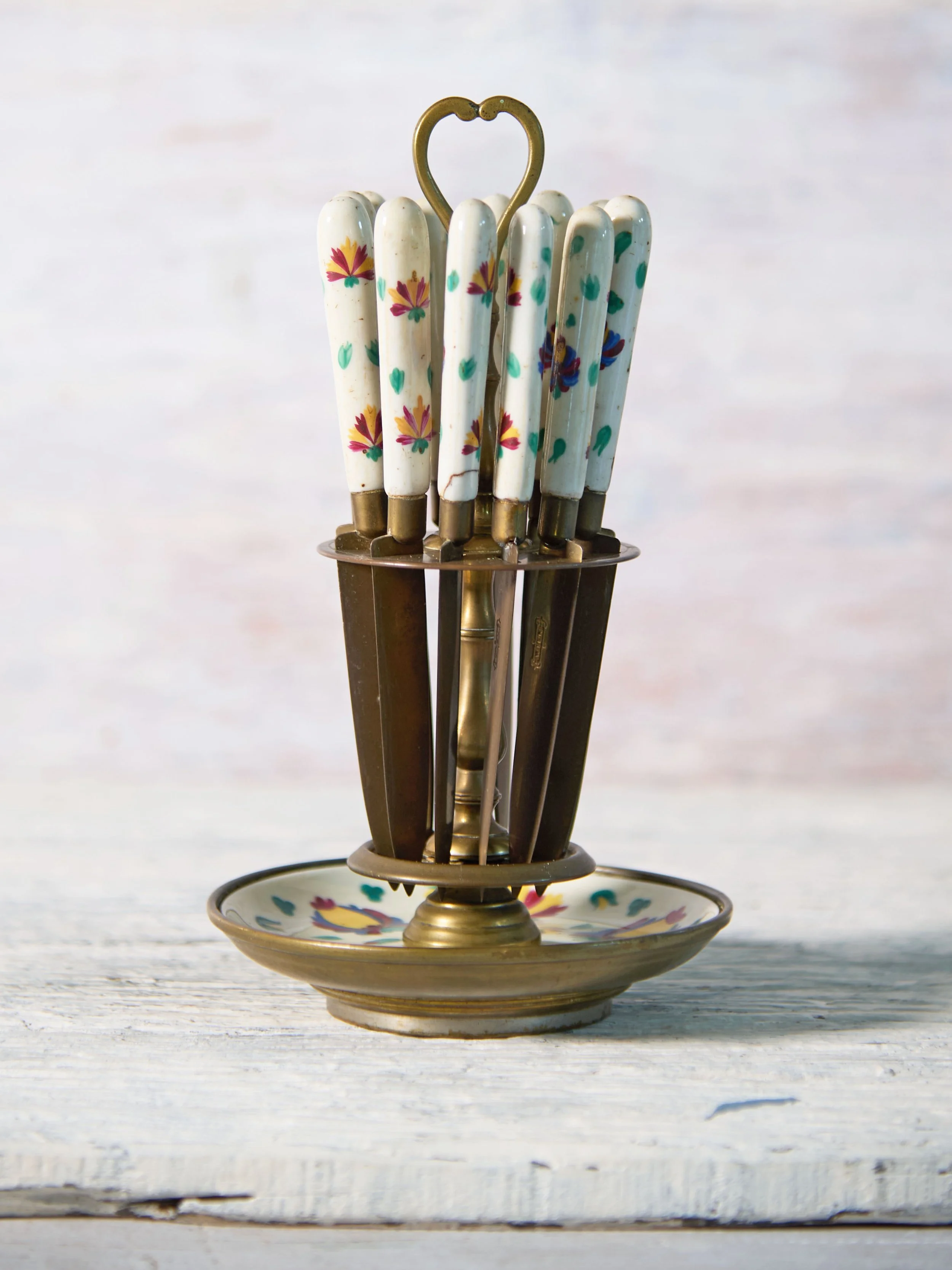 Vintage fruit knives in old stand