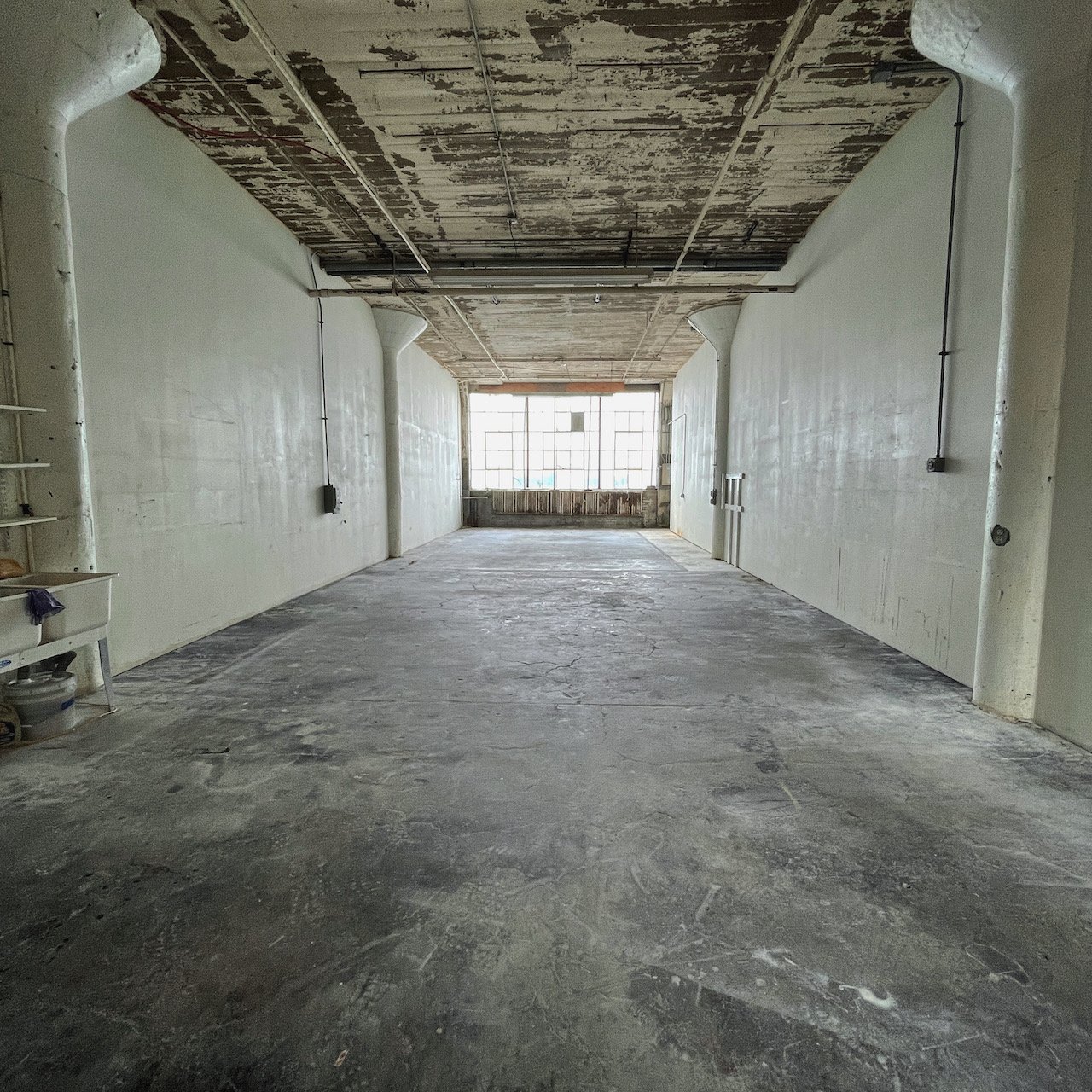  An image of empty warehouse where Lauren HB Studio will display and create their artowrk 