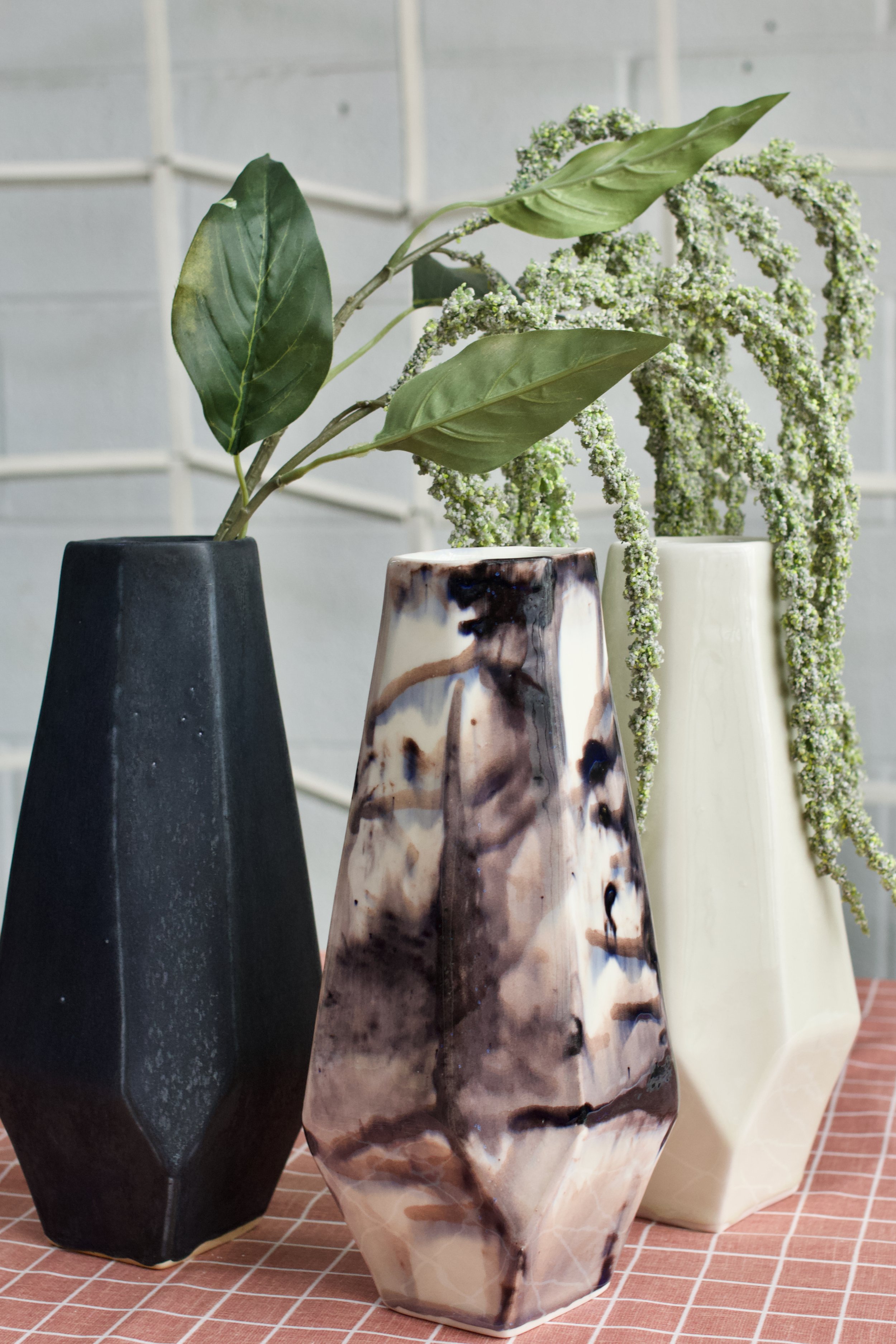  Lauren HB Studio’s Core Collection of three different vases with greenery in them 