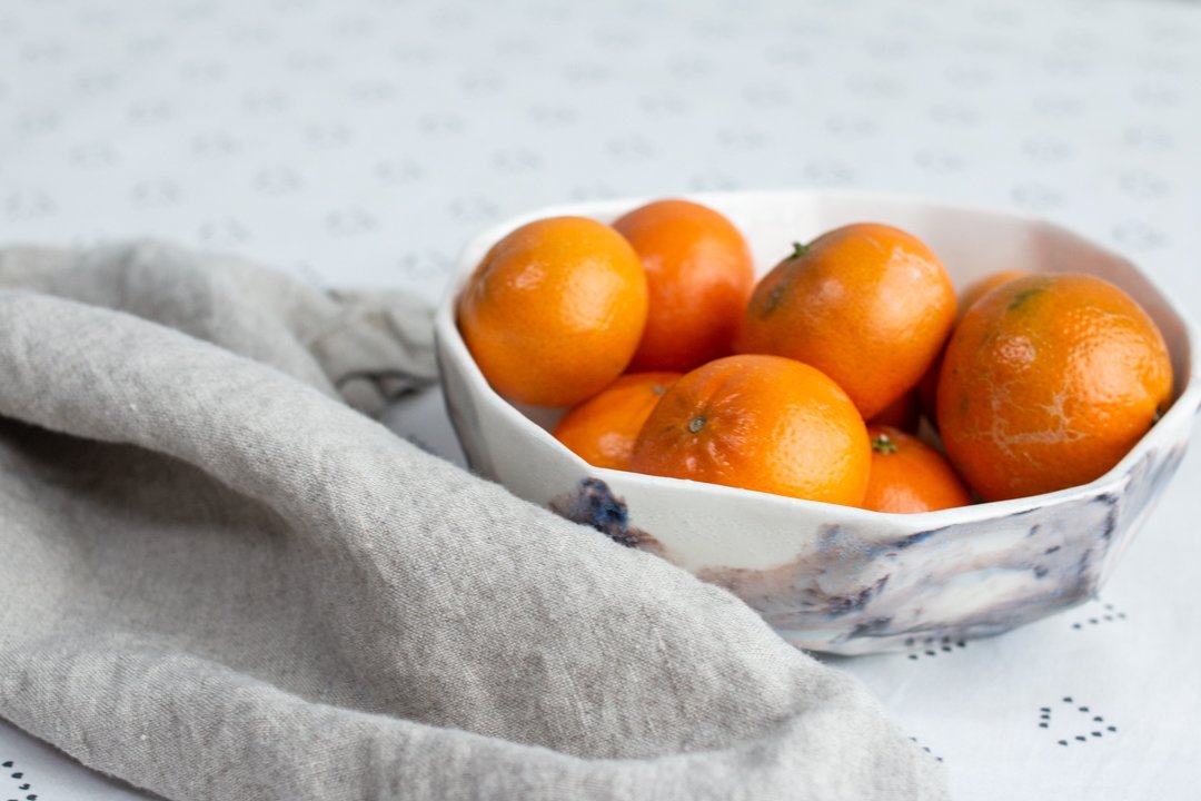  Geometric large stone bowl holding oranges a part of the Juniper Collection made by Lauren HB Studio 