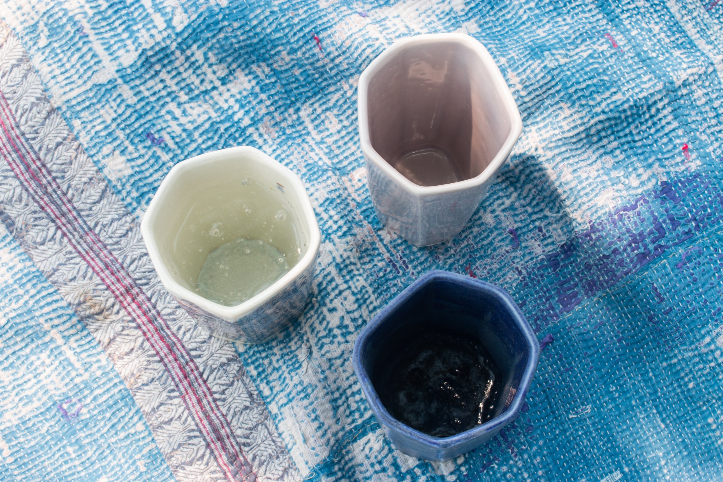  Three ceramic cups in the summer pot collection hand made by Lauren HB Studio available for purchase on our online shop 